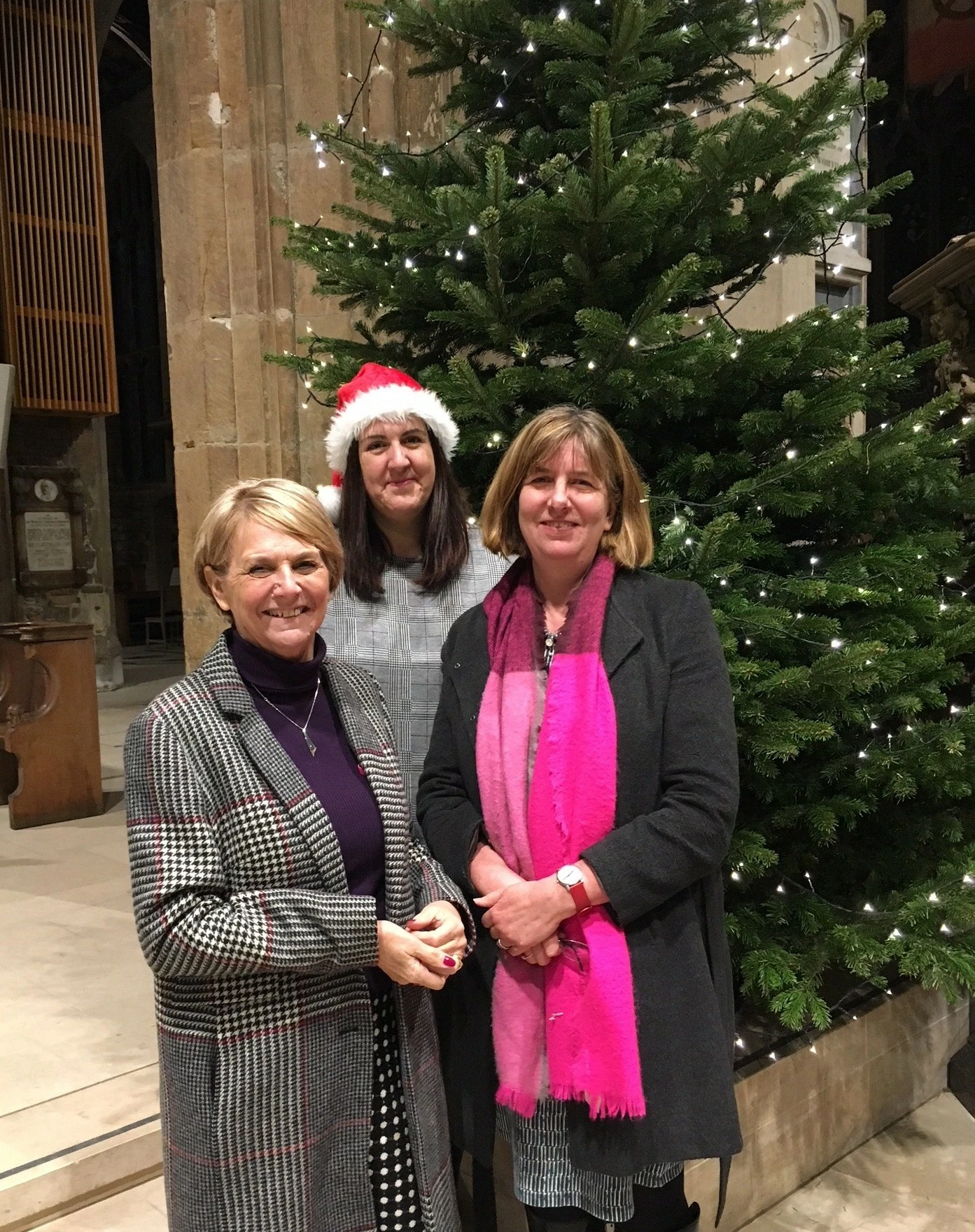 Picture caption: Carols for a great cause: l to r Deborah Adams and Sarah Herrett from Breast Cancer Care with Vanessa Fox at the Sheffield Cathedral event. 