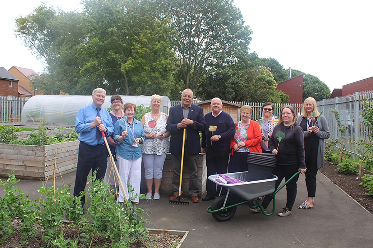 Members of Pottery Bank Community Centre with Martin Foster from Stagecoach (far left) and the new gardening equipment