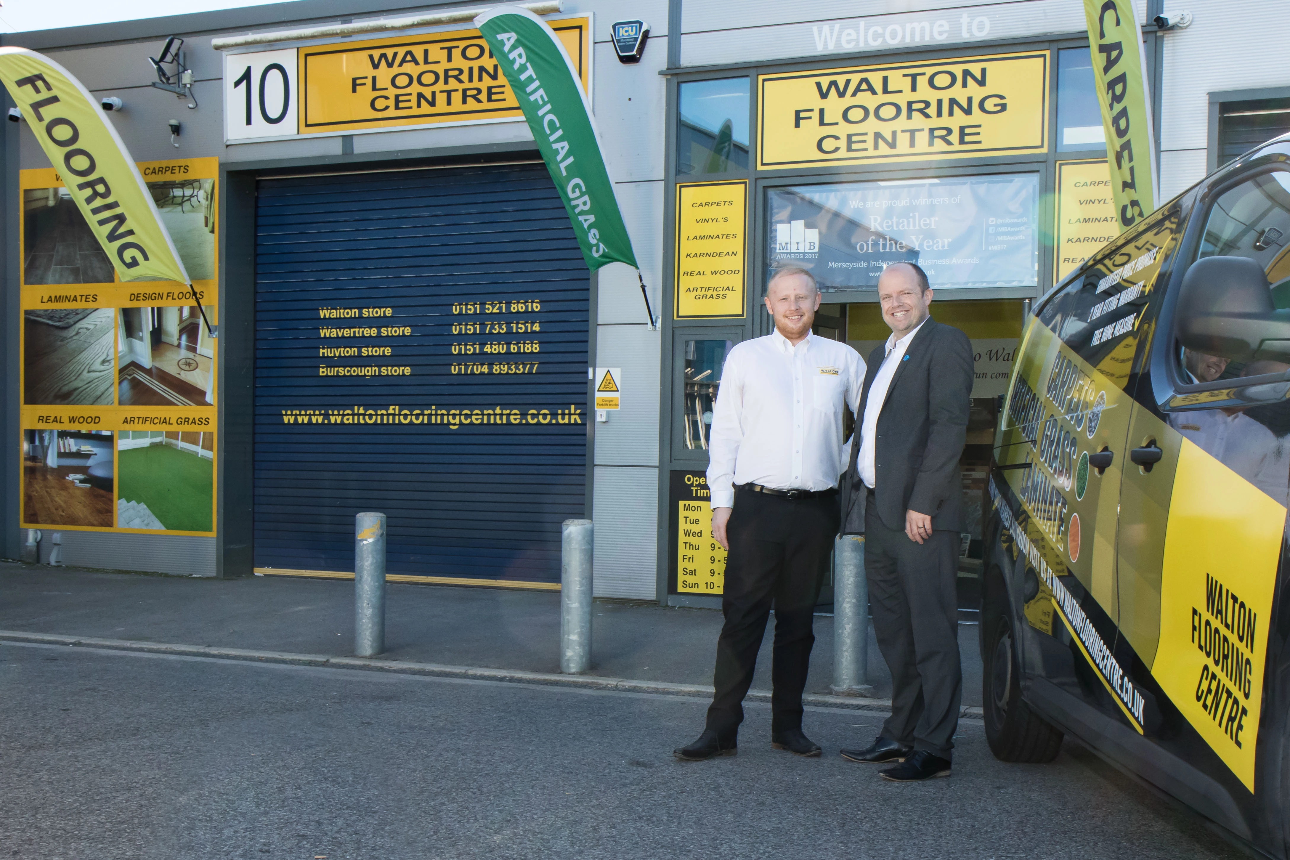 James Harper of Walton Flooring Centre and Paul Trickett of Bathgate Business Finance outside Walton Flooring Centre headquarters in Huyton