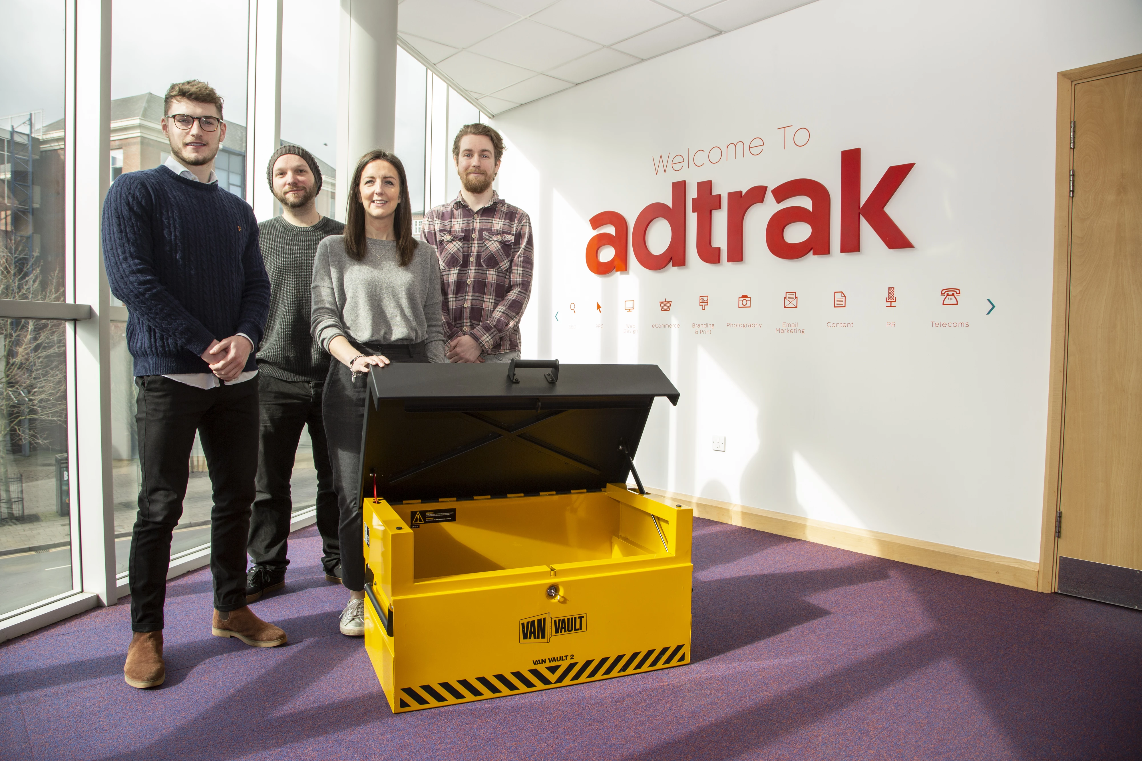 left to right Jamie Neep, Alun Davies, Sarah Shaw and Nathan Fidler from Adtrak Creative with a Van Vault