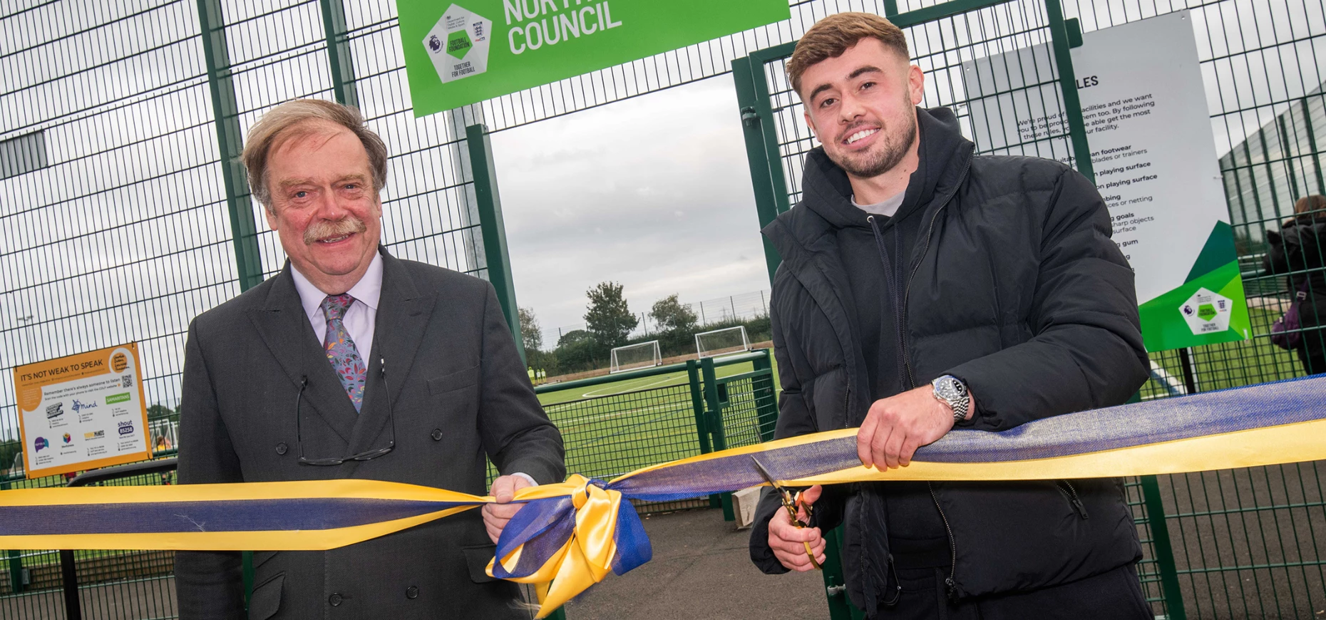 Councillor Simon Myers and professional footballer Alfie McCalmont cut the ribbon to officially open the new 3G pitch and pavilion in Sowerby.
