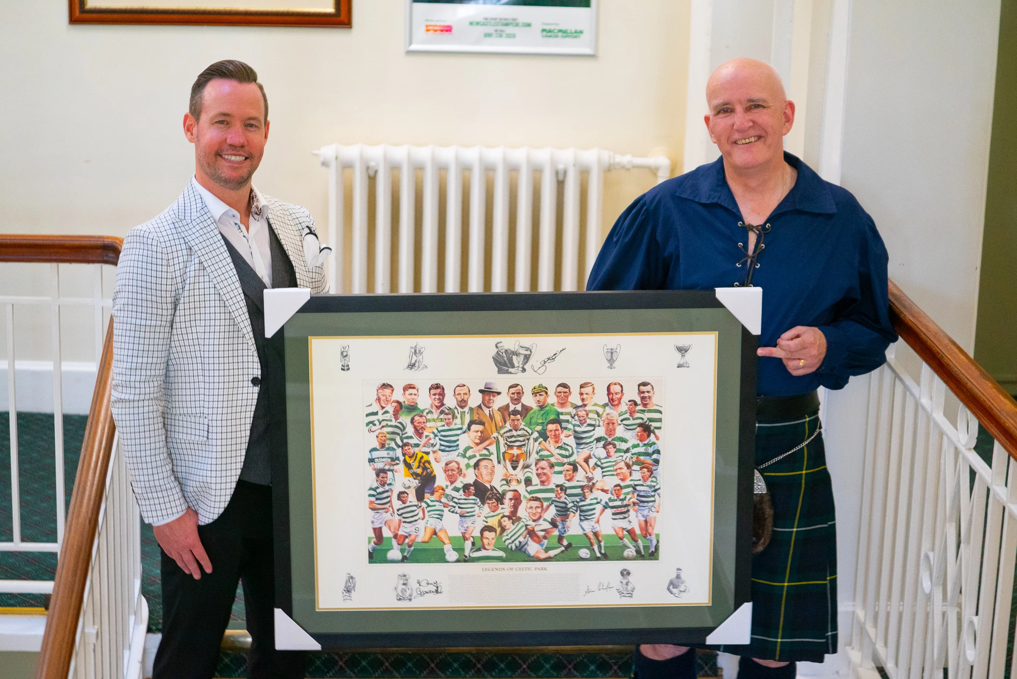 John Savage (left) presents the autographed Celtic print to Danny Byrne 