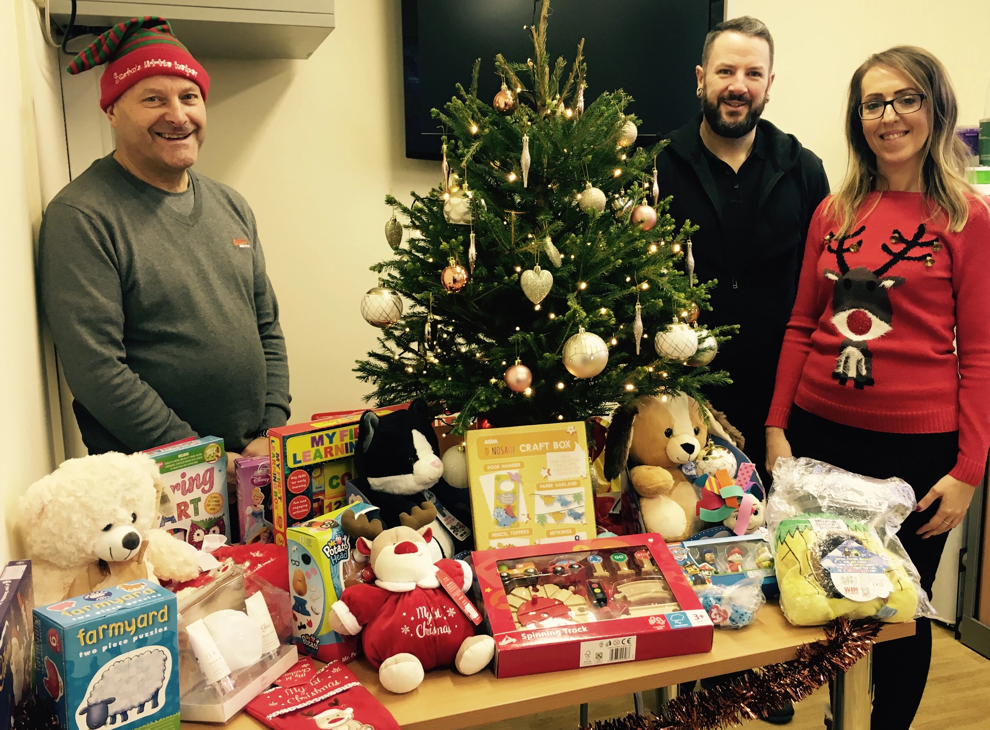 Kevin Stoner, Ric Daniels and Rebecca Holden, from the Supported Tenancies Service at Salix Homes, with some of the toys and gifts that have been donated.