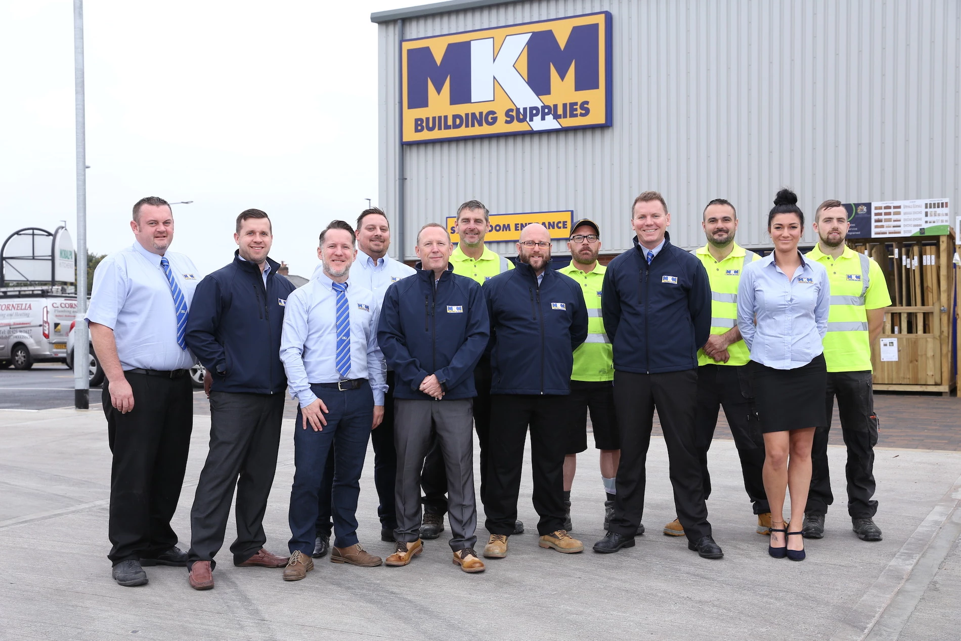 Branch Directors Ian Greenhough and David Harari with the new team at MKM Warrington.