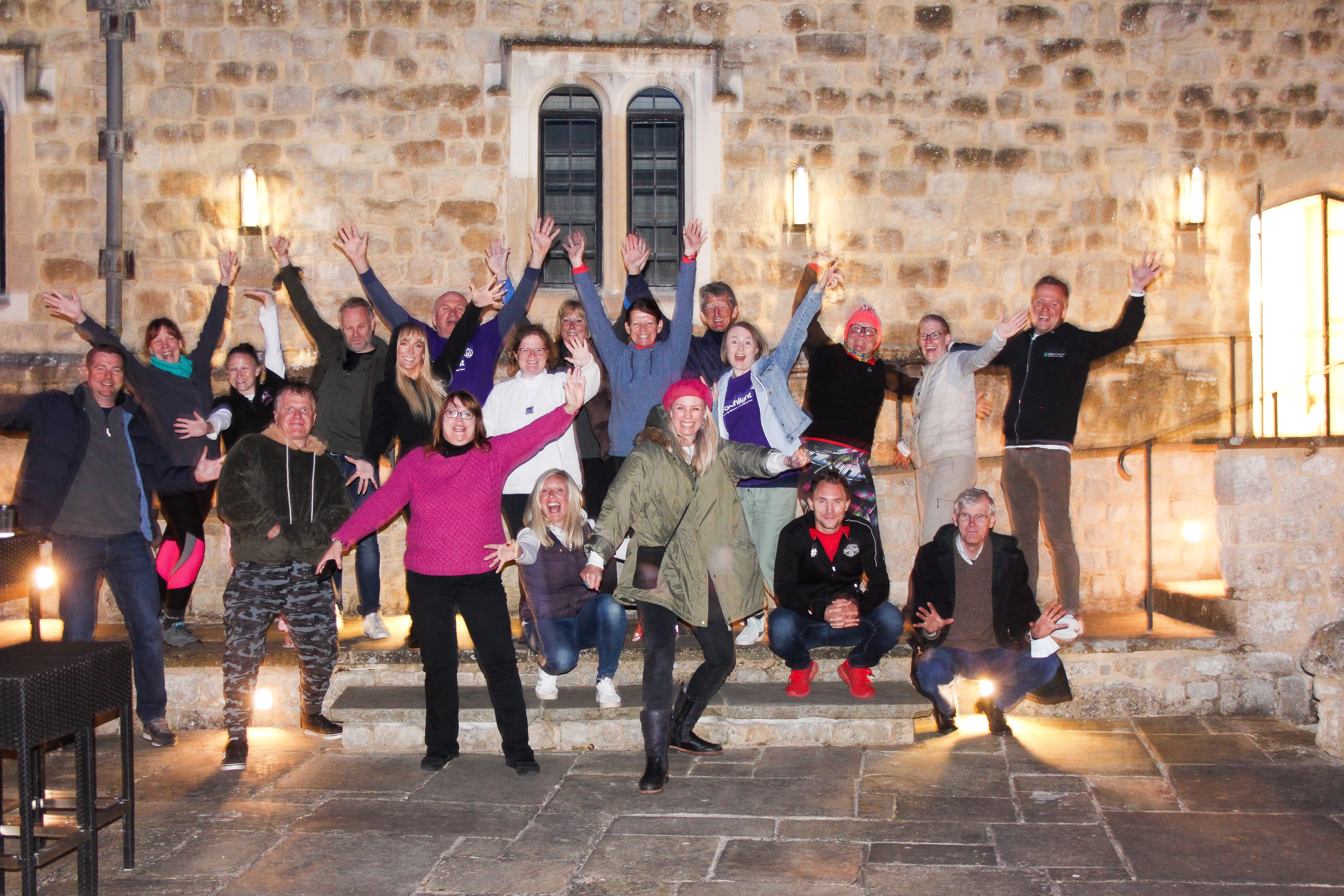 Bianca Robinson, Chief Executive Officer of CEO Sleepout, with event participants at Leeds Castle, Kent.
