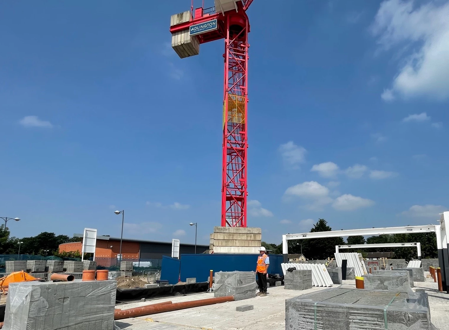 Wayne Green, site manager, in front of crane