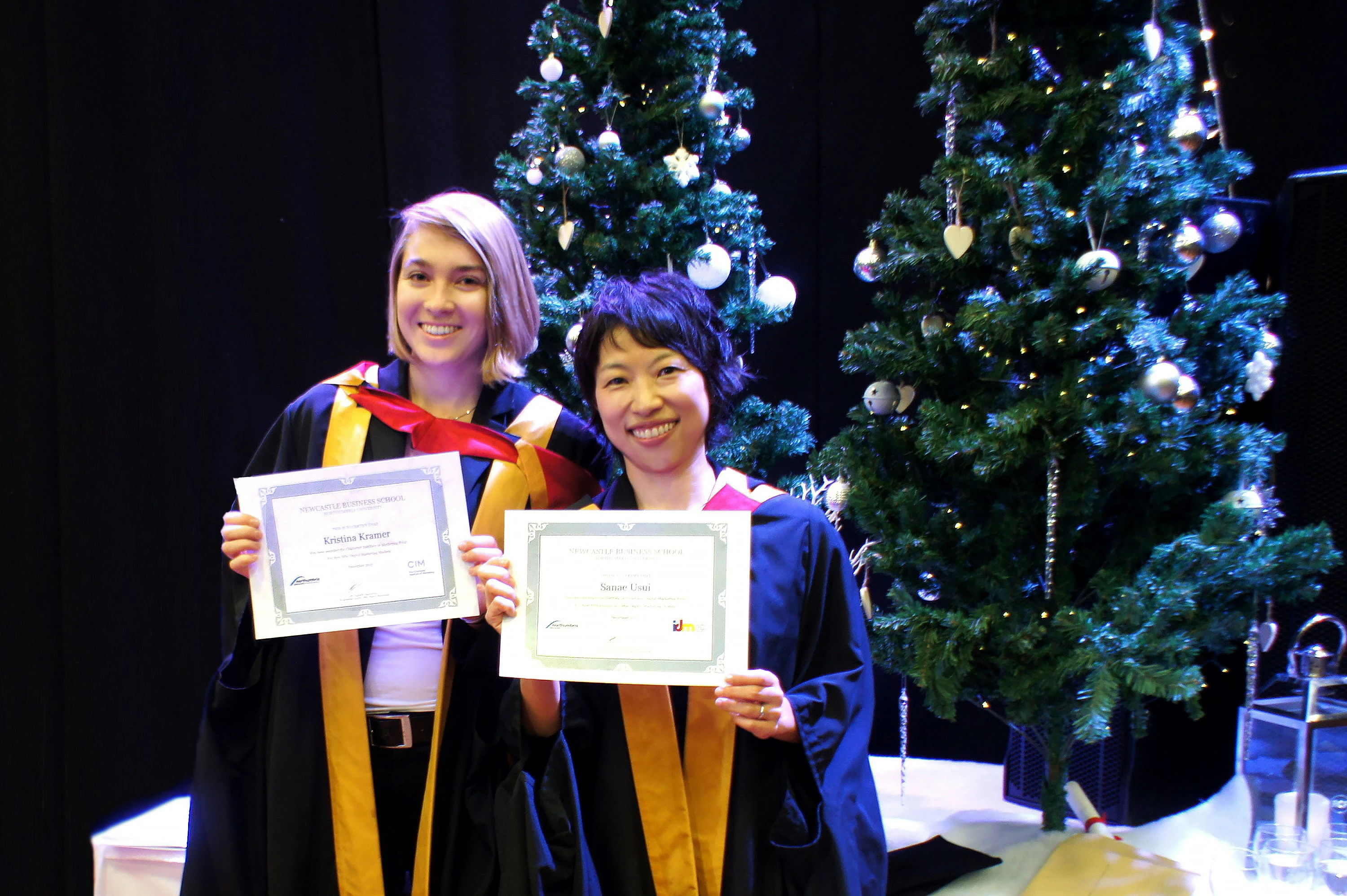 Award-winning students Kristina Kramer (L) and Sanae Usui