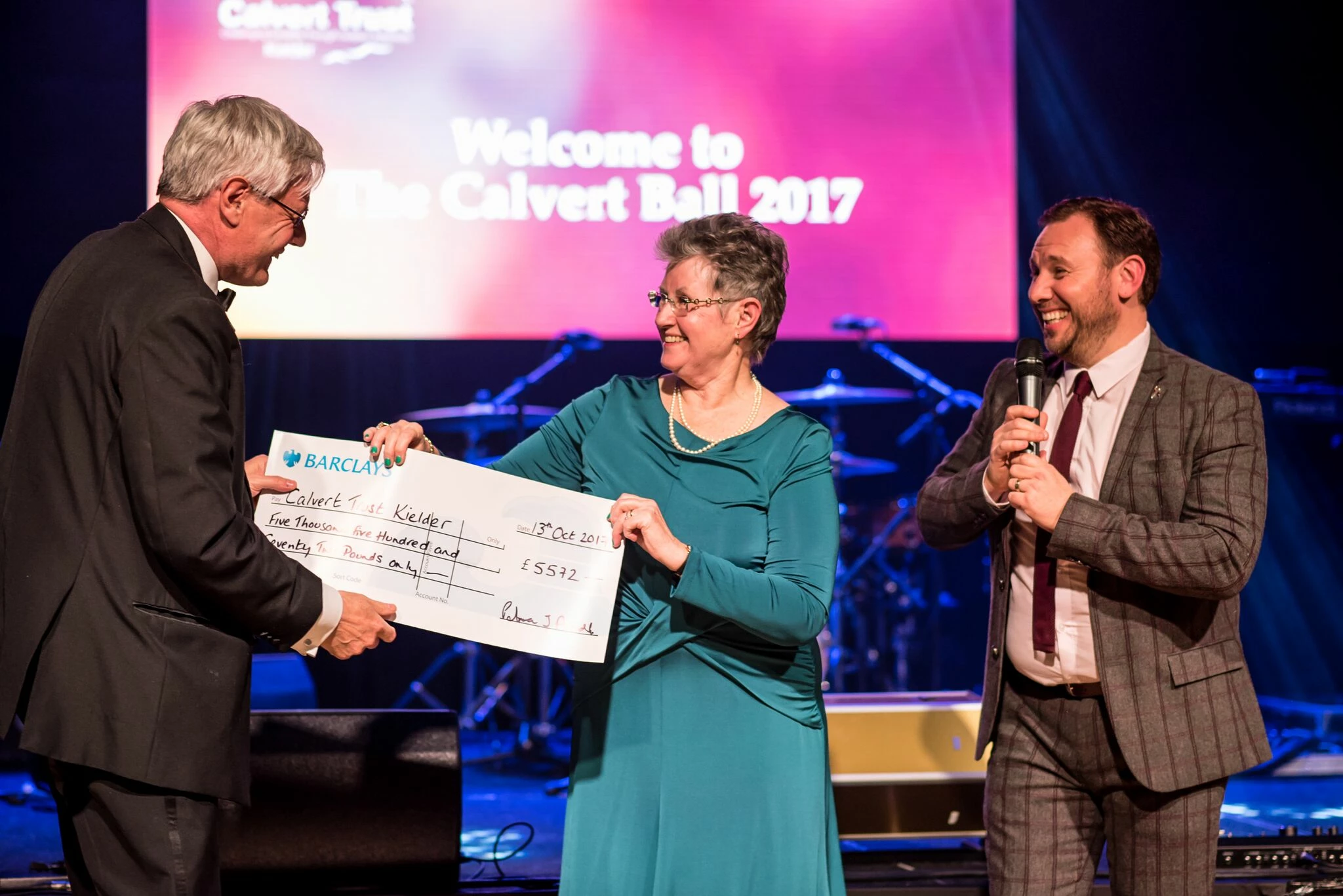 Patricia Arnold presenting Calvert Trust Kielder's Peter Cockerill with their donation.