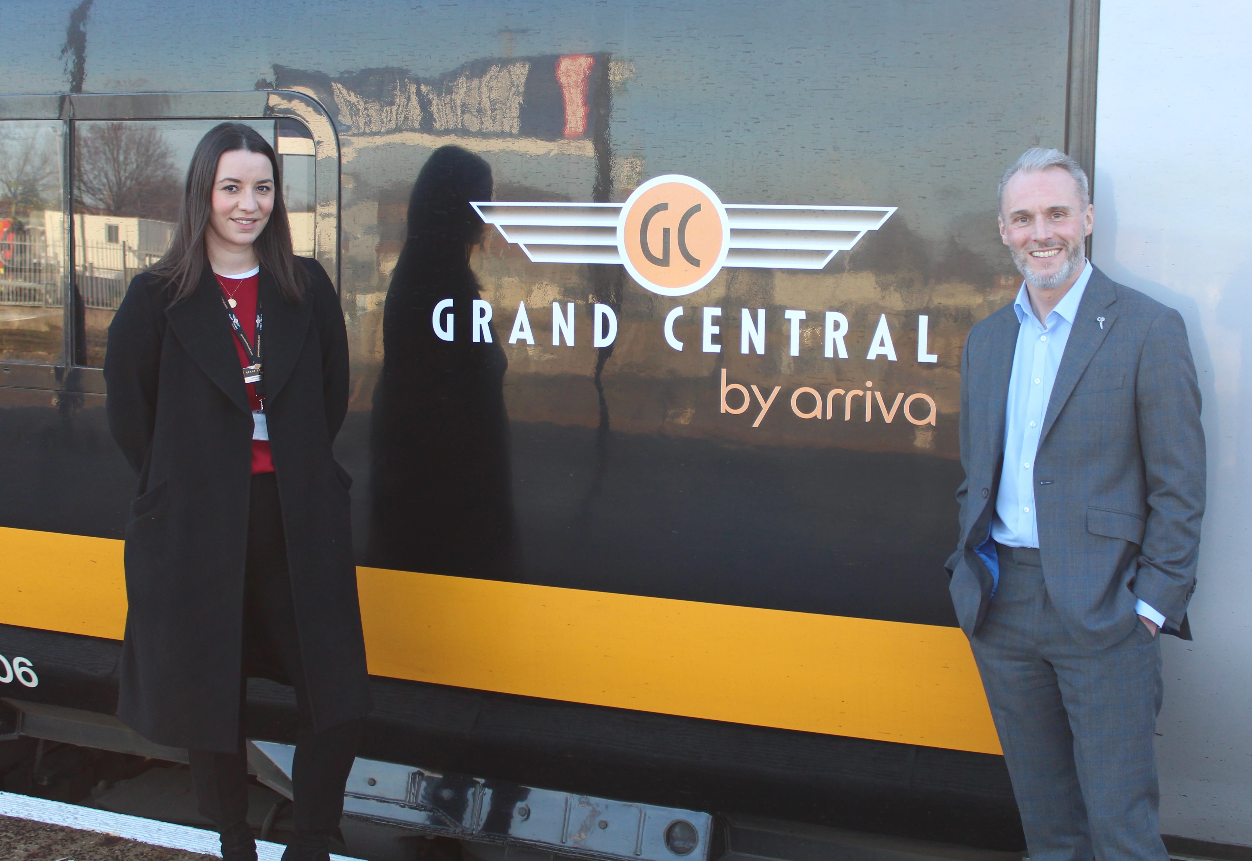 Hannah Bromage (Delivery Manager Community and Stations for Grand Central) with John Williams (Commercial Director for FC Halifax Town).
