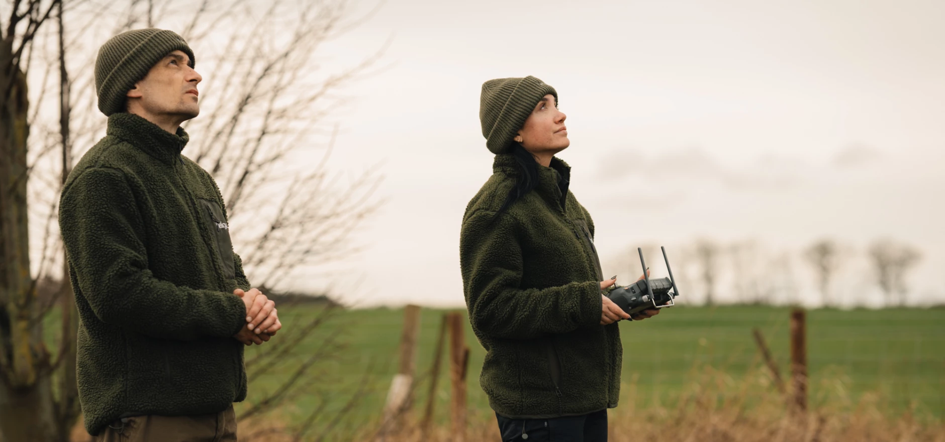 heliguy's Tom Anderson (L) and Lois Smith flying a drone.jpg