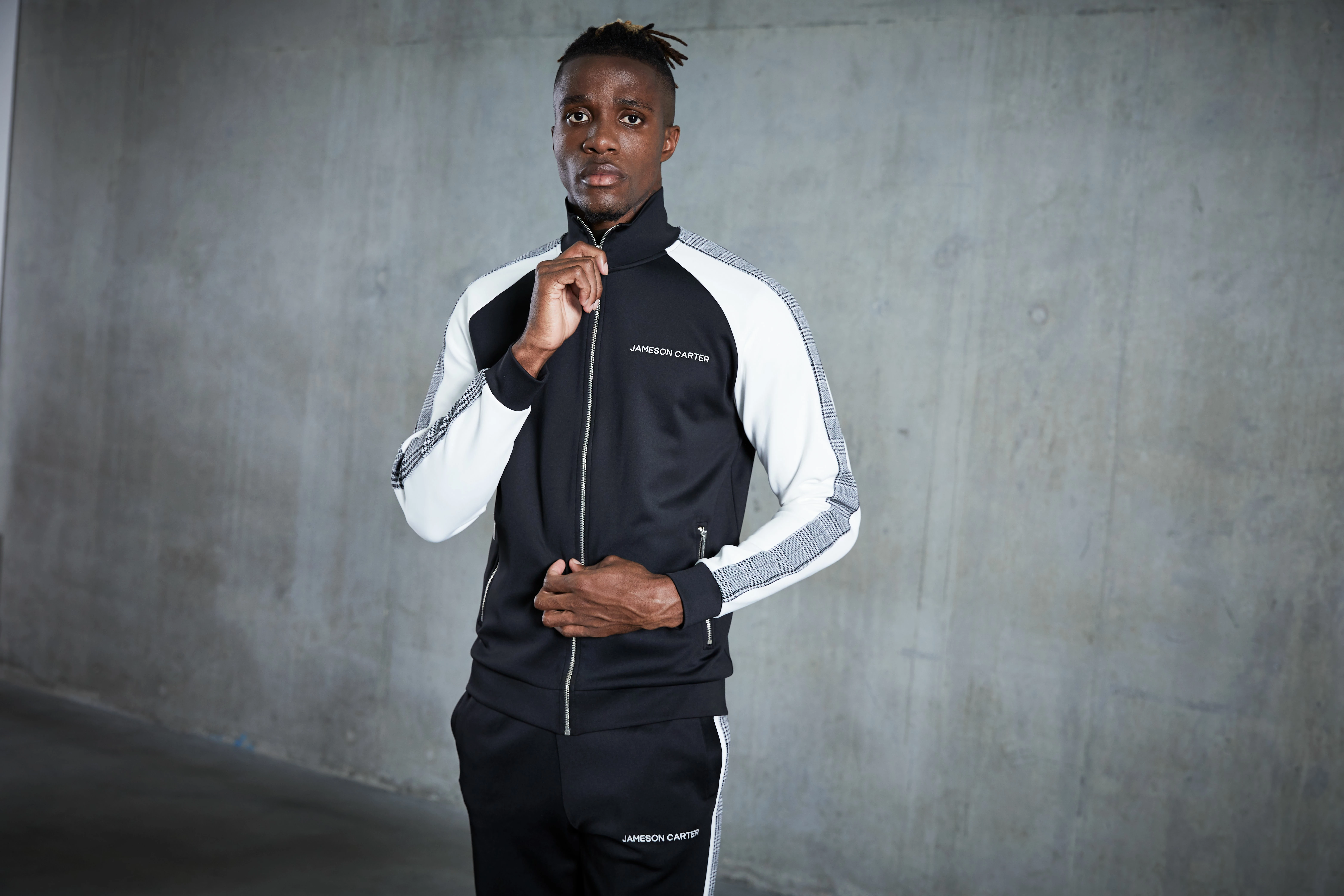 Crystal Palace footballer Wilfried Zaha modelling a tracksuit from his 'Wilfried Zaha x Jameson Carter' collection