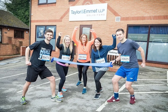 Head of Taylor&Emmet's Dronfield office, Sarah Gaunt (centre) and colleagues prepare for the town's 10K. 