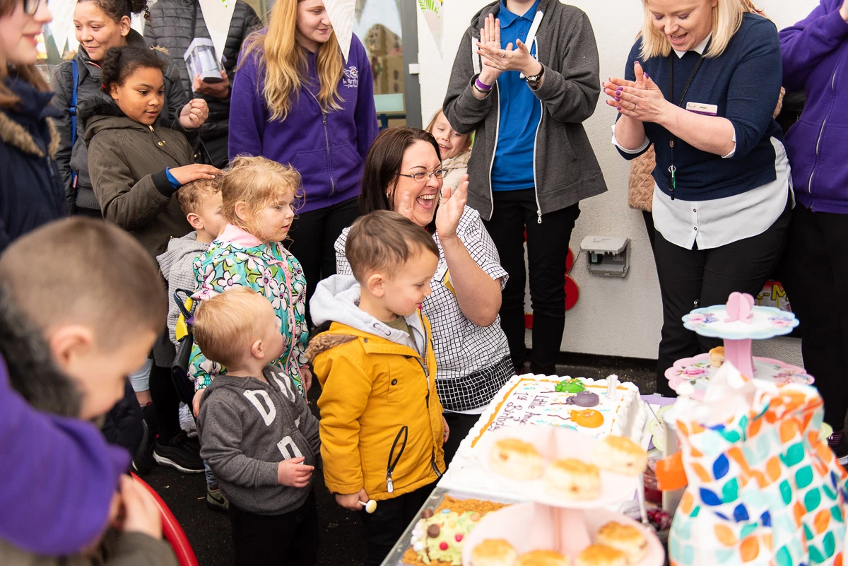 Natasha Meehan, manager of Little Angels, celebrates with staff and children at the nursery