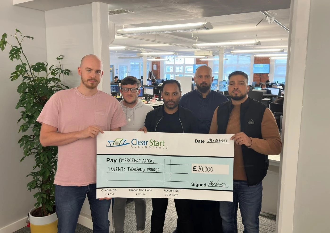 Clear Start Accountants CEO Fiaz Ashraf (second from right), pictured with Mohammed Abubakar, Chairman and Trustee of Smile Aid (far right)