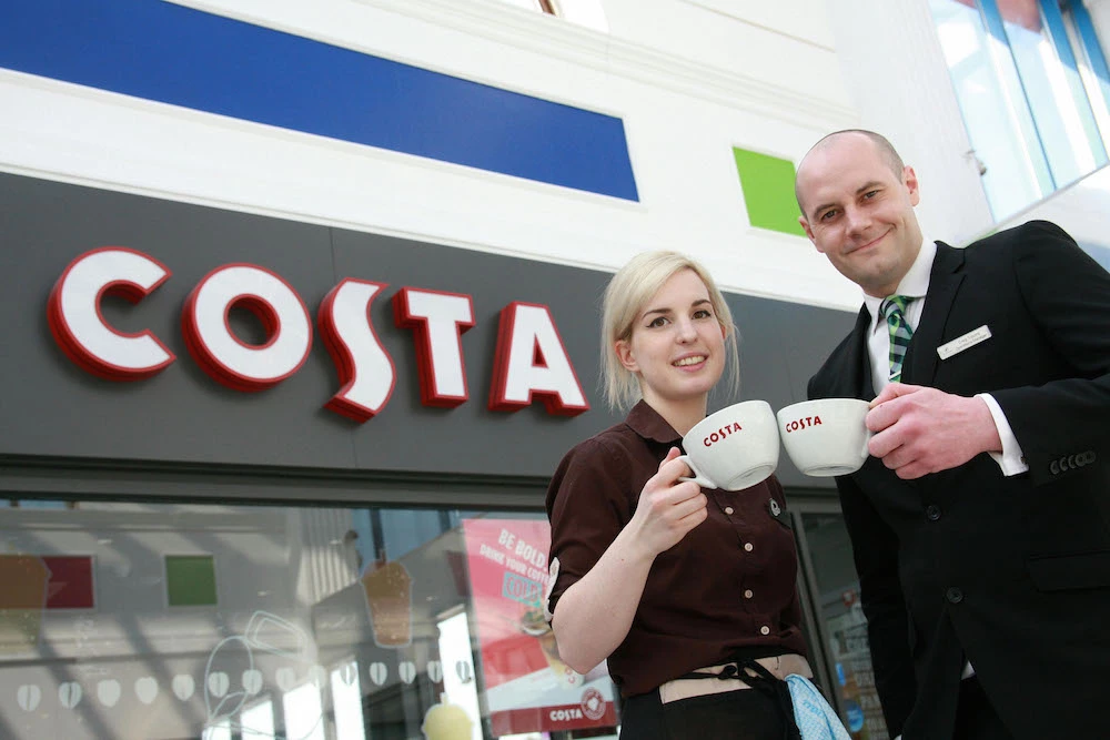 Stretford Mall operations manager Craig Topping with Costa Coffee barista maestro Alexandra Martin