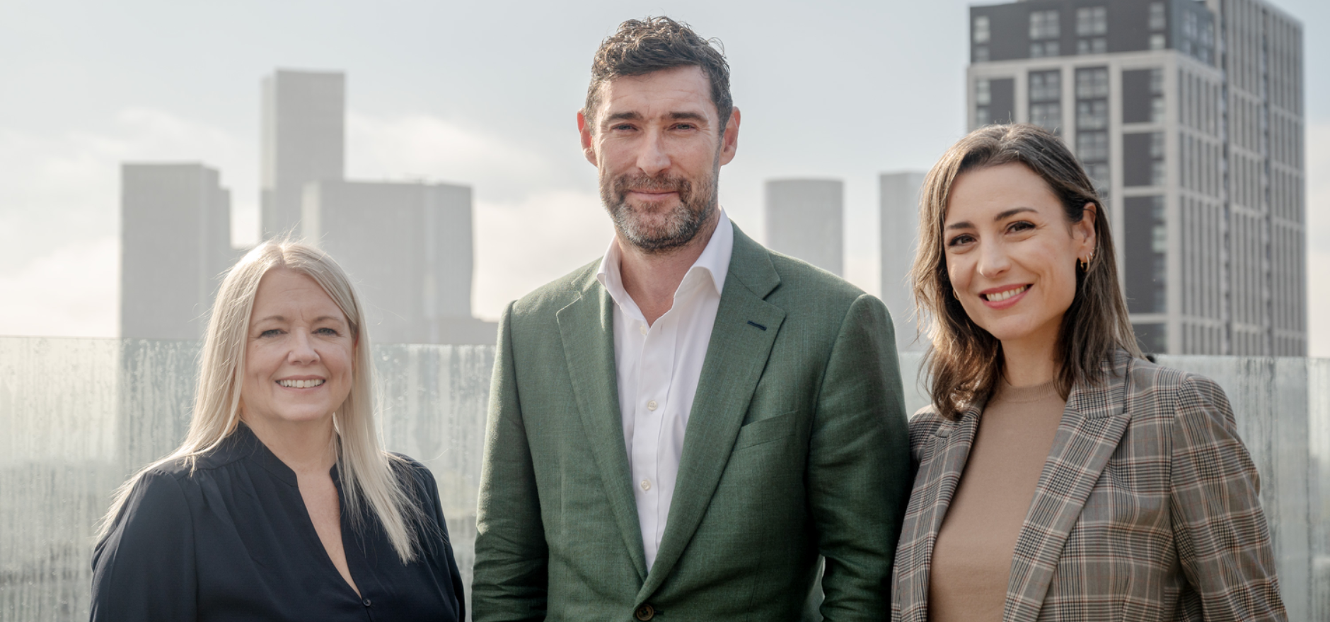 From l to r Hilary Pascoe and Dan Booth from Leonard Curtis with Laura Percy from Muse on top of the Eden building in Manchester.jpg