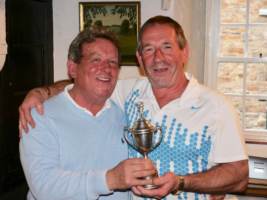 Martin-Brooks' managing director, John Elmore, celebrates his hole-in-one with charity golf day winner, Paul Joynes. 
