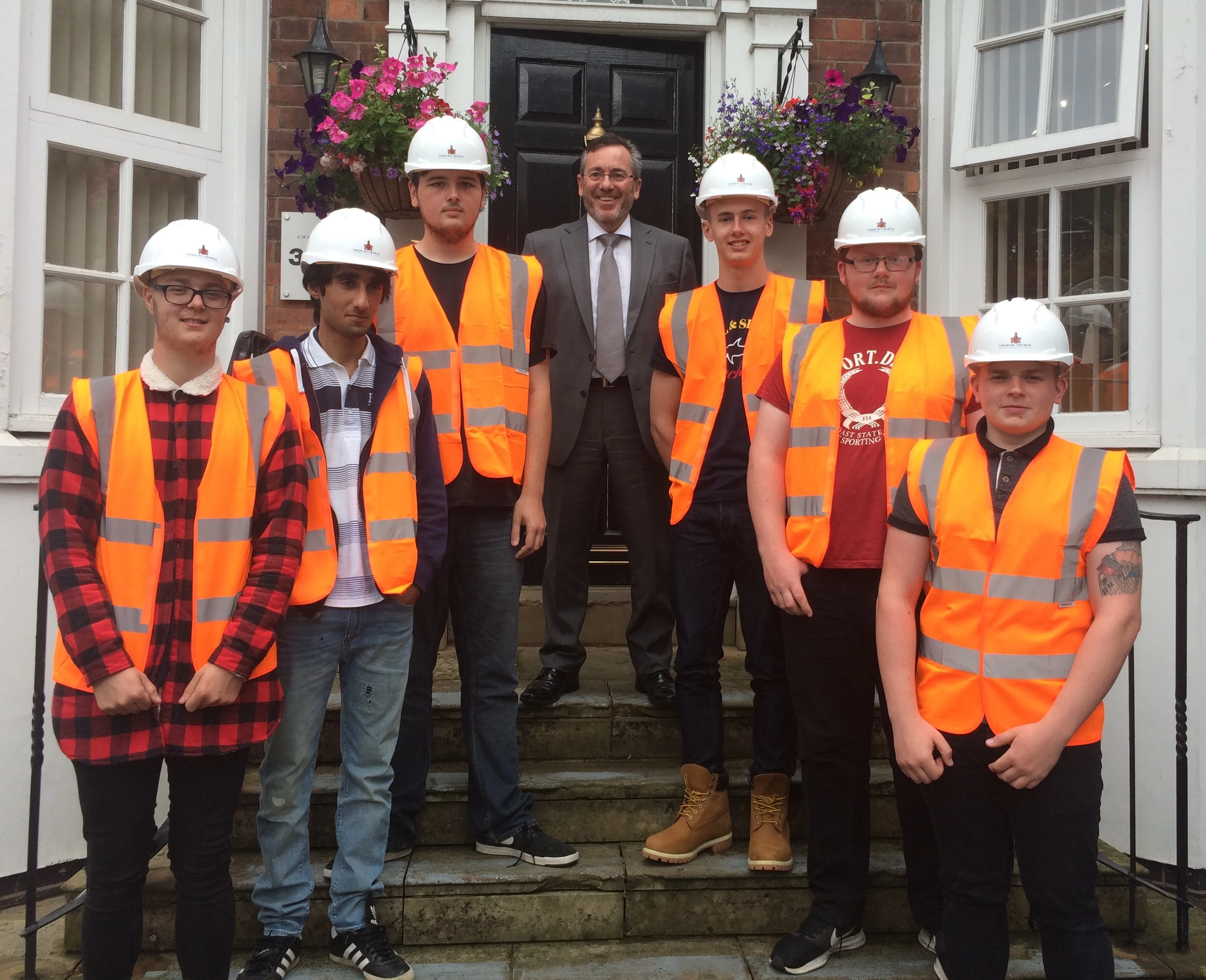 Mark Cook, Regional Managing Director of Persimmon Homes North West, is pictured with the six new brickwork recruits, from left: Jay Smith, Hassan Amin, Nathan White, Lewis Morris, Robbie Doran and Daniel Clare