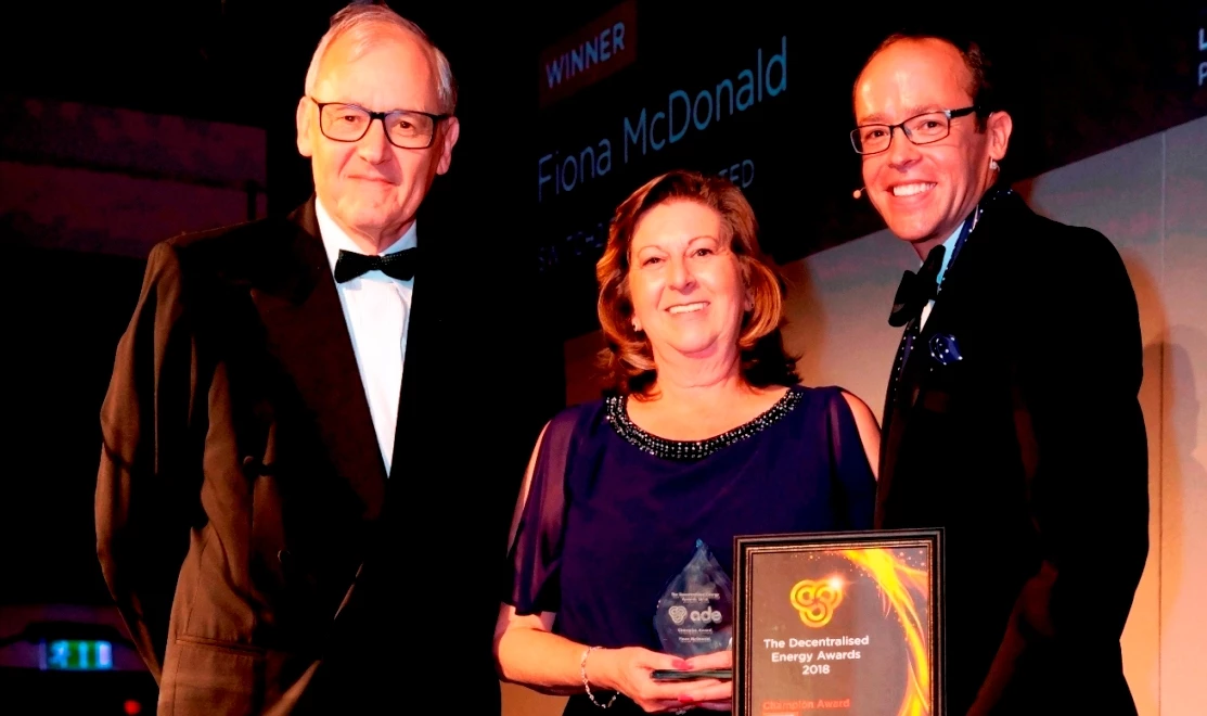 Switch2's Fiona McDonald receives the Champion Award from ADE president Lord Risby (left) and ADE Director Tim Rotheray