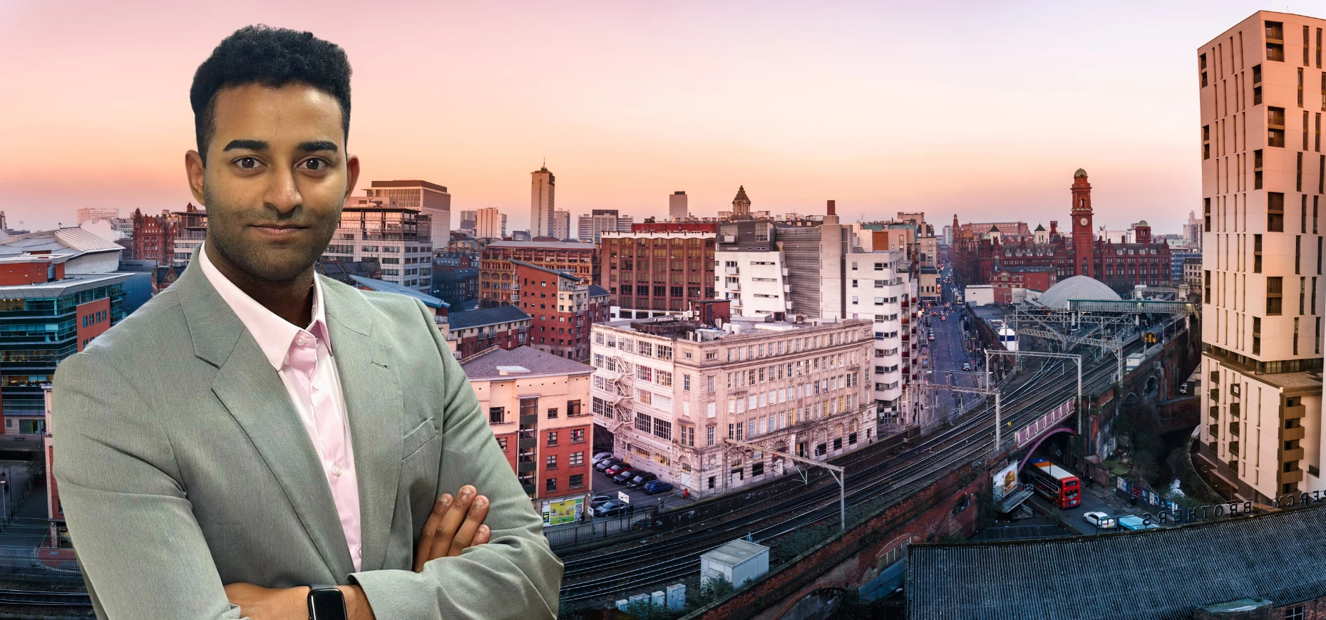 Mohamed Hamza, Senior Legal Consultant at The City Recruiter, stands in front of the Manchester skyline.