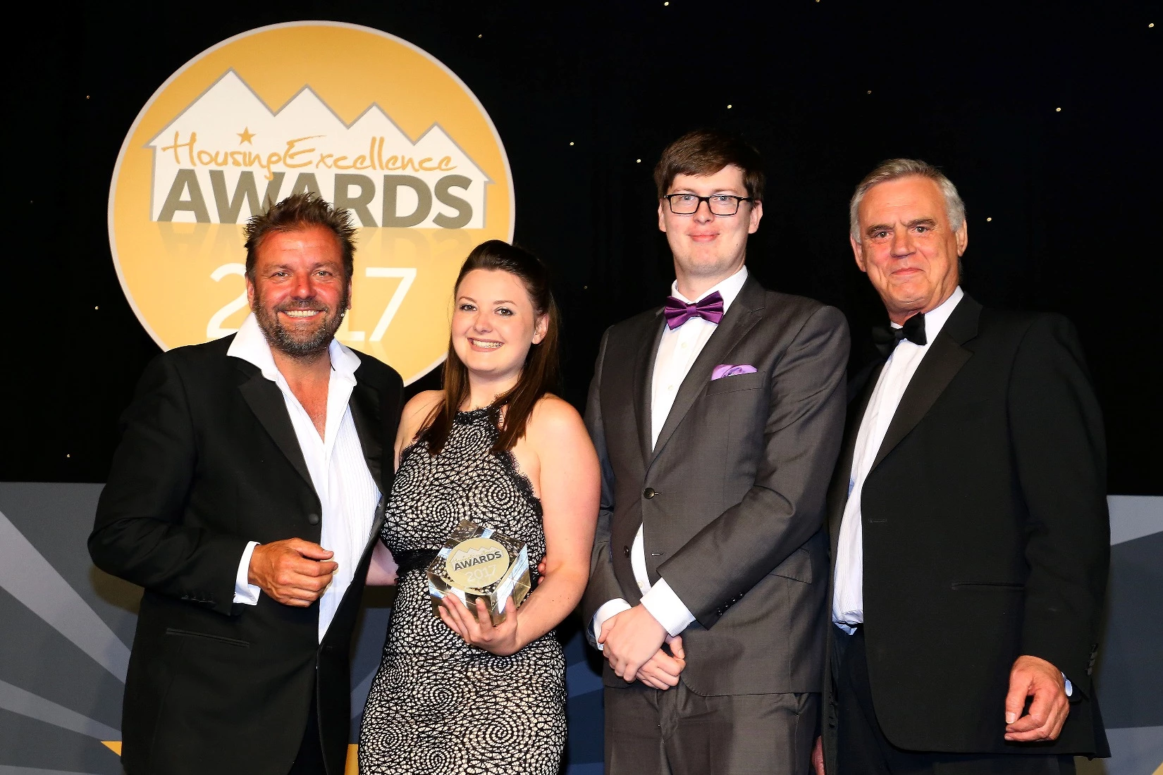 Pictured (l-r) are:  Martin Roberts, Host of TV's Homes under the Hammer), Switch2's Rebecca Stenson and Mark Tyson, with awards judge Mike Brogan, CEO of Procure Plus.