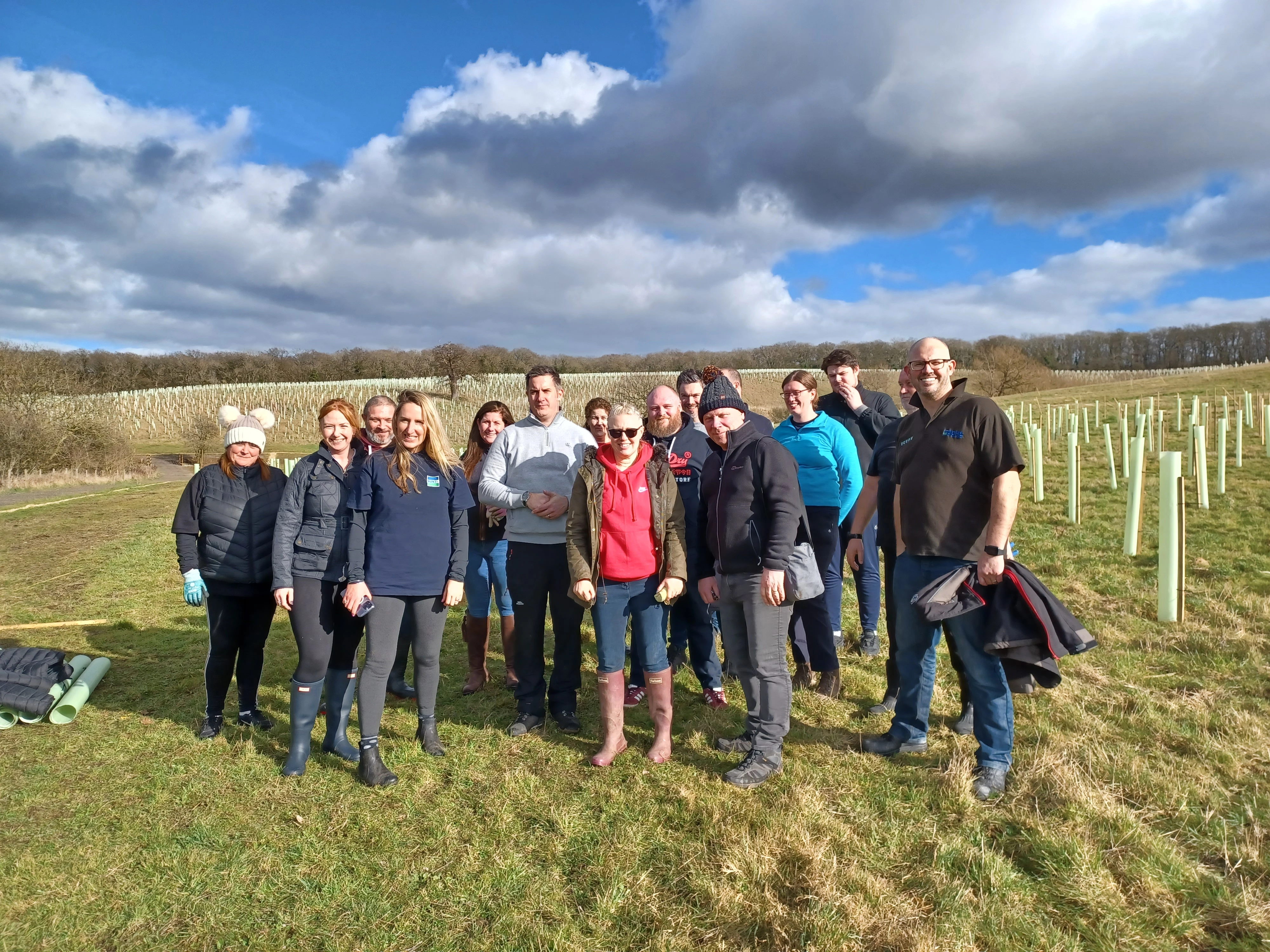 Colleagues come together to plant trees