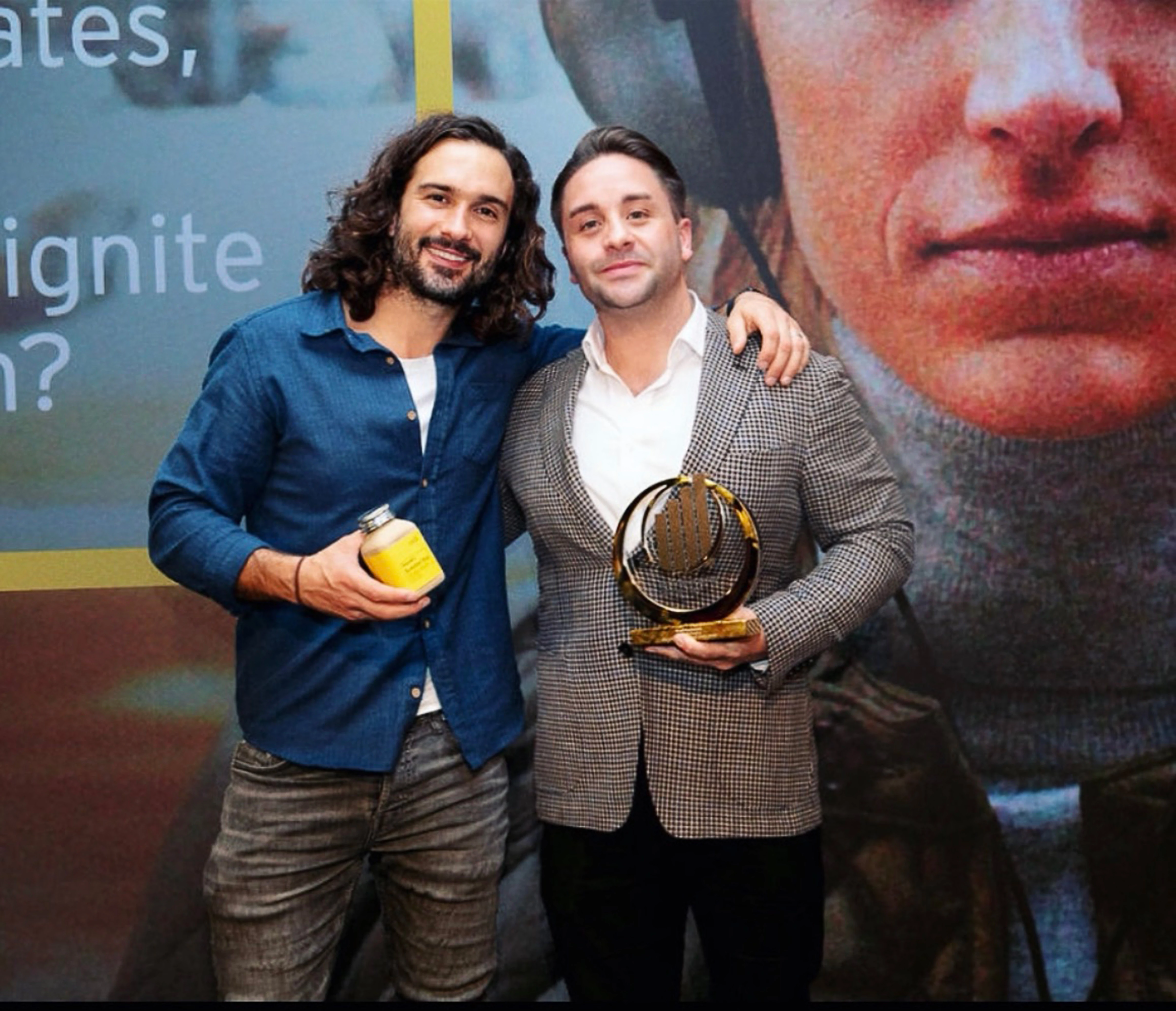 Cullen Eco Packaging owner David MacDonald receives his EY Entrepreneur of the Year award from Joe Wicks
