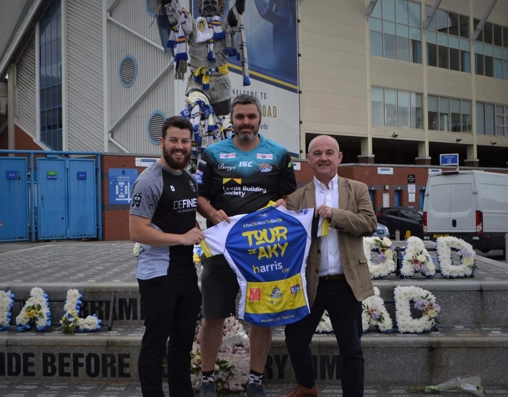 Antony Woods of Defined Intervention, the supplier of the cycling jerseys, PC Pierre Olesqui who organised the event and Paul Taylor of sponsors Harris CM, outside Elland Road which is one of the locations the ride will visit.