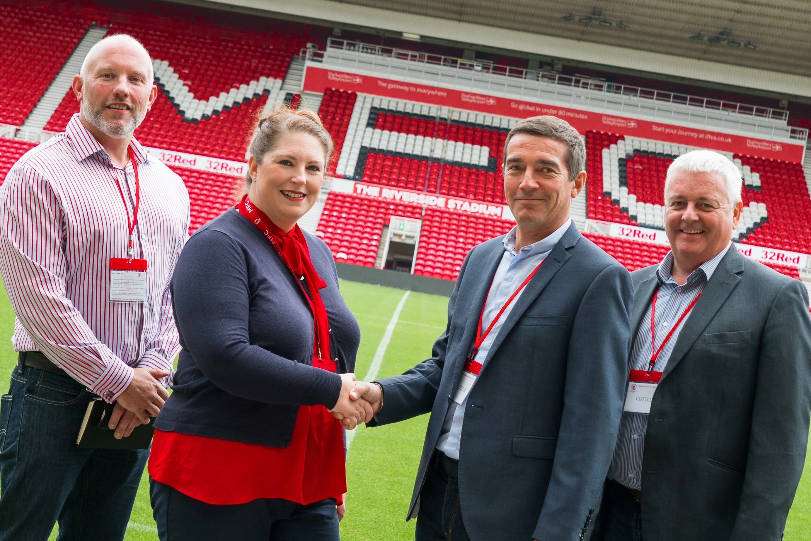 Steven Baker, Food Service Manager, James Munro, Managing Director, and Sales Controller David Mason of Country Valley Foods pictured with Anne-Marie Anderson of MFC Foundation at Boro's Riverside Stadium