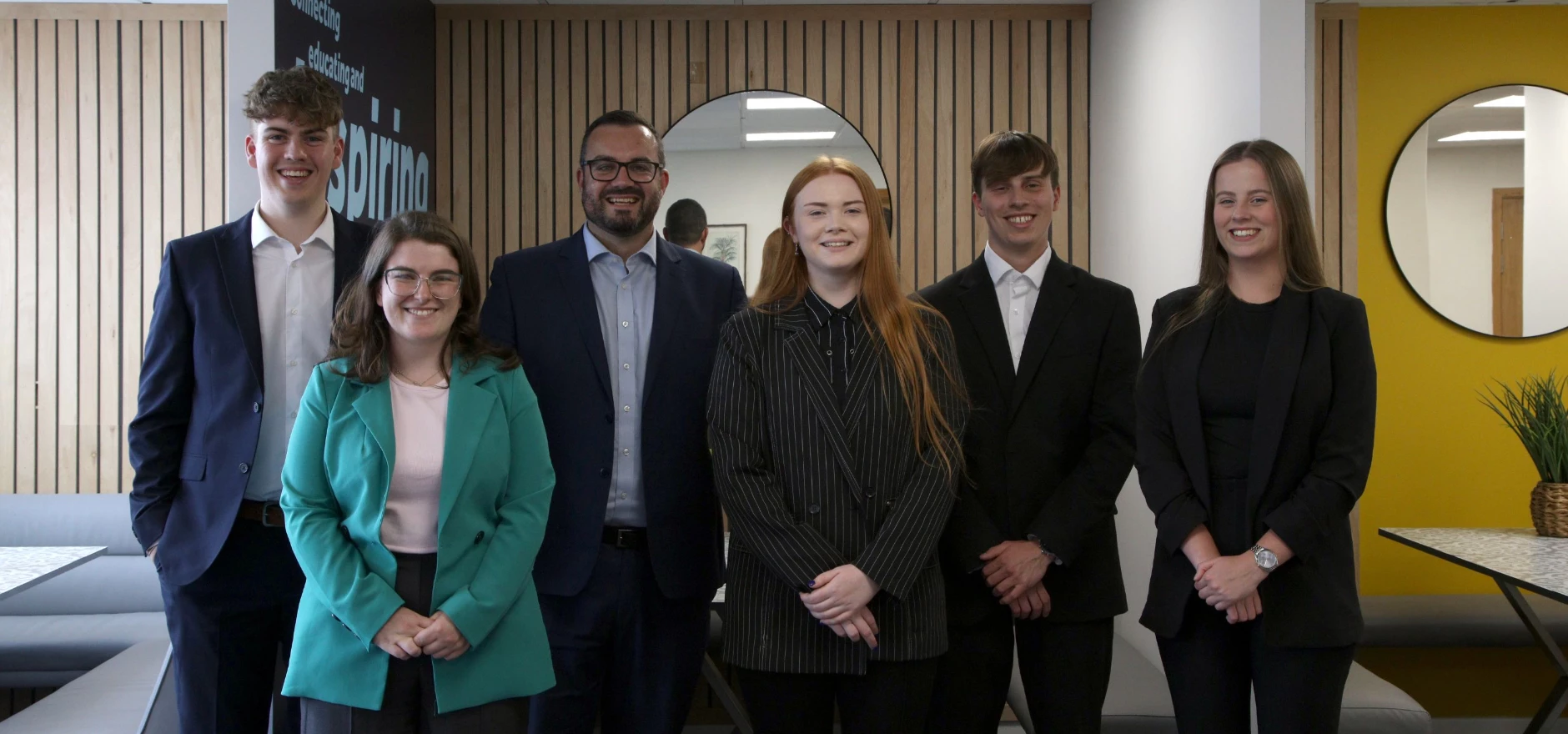 Joe Ridgeon (third from left) welcomes new starters Lewis Davison, Niamh McDonald, , Rachael Bridges, Luca Curini and Ebony Rolfe to Hedley Planning.jpg
