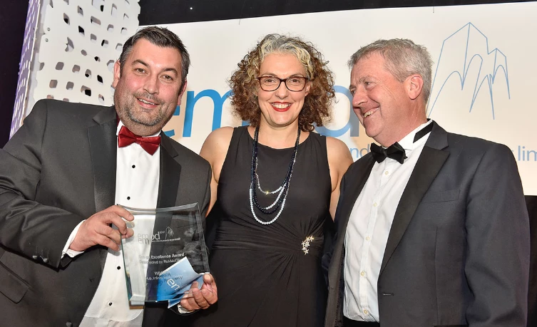 Cllr Martin Rawson, deputy leader of Derby City Council (left) and Greg Jennings, head of regeneration (right), accept the Design Excellence award from Nadia Rizk, creative director of sponsors RizkMcCay.
