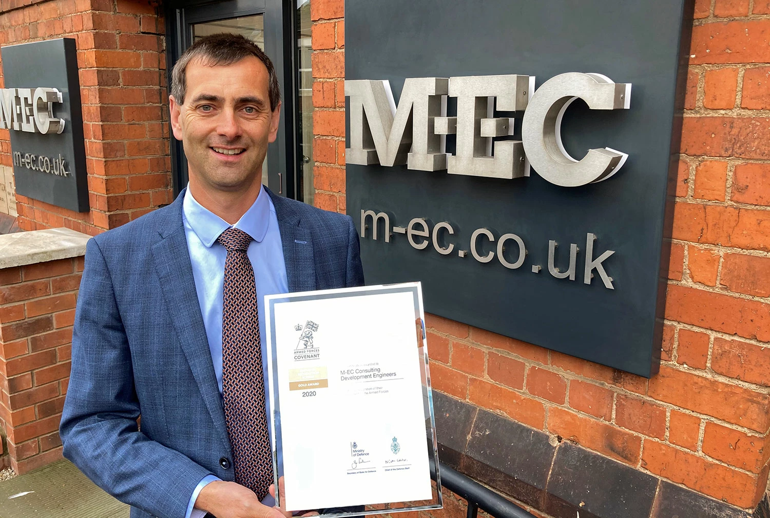 Eddie Mewies, manging director of M-EC, holding ERS Gold Award certificate