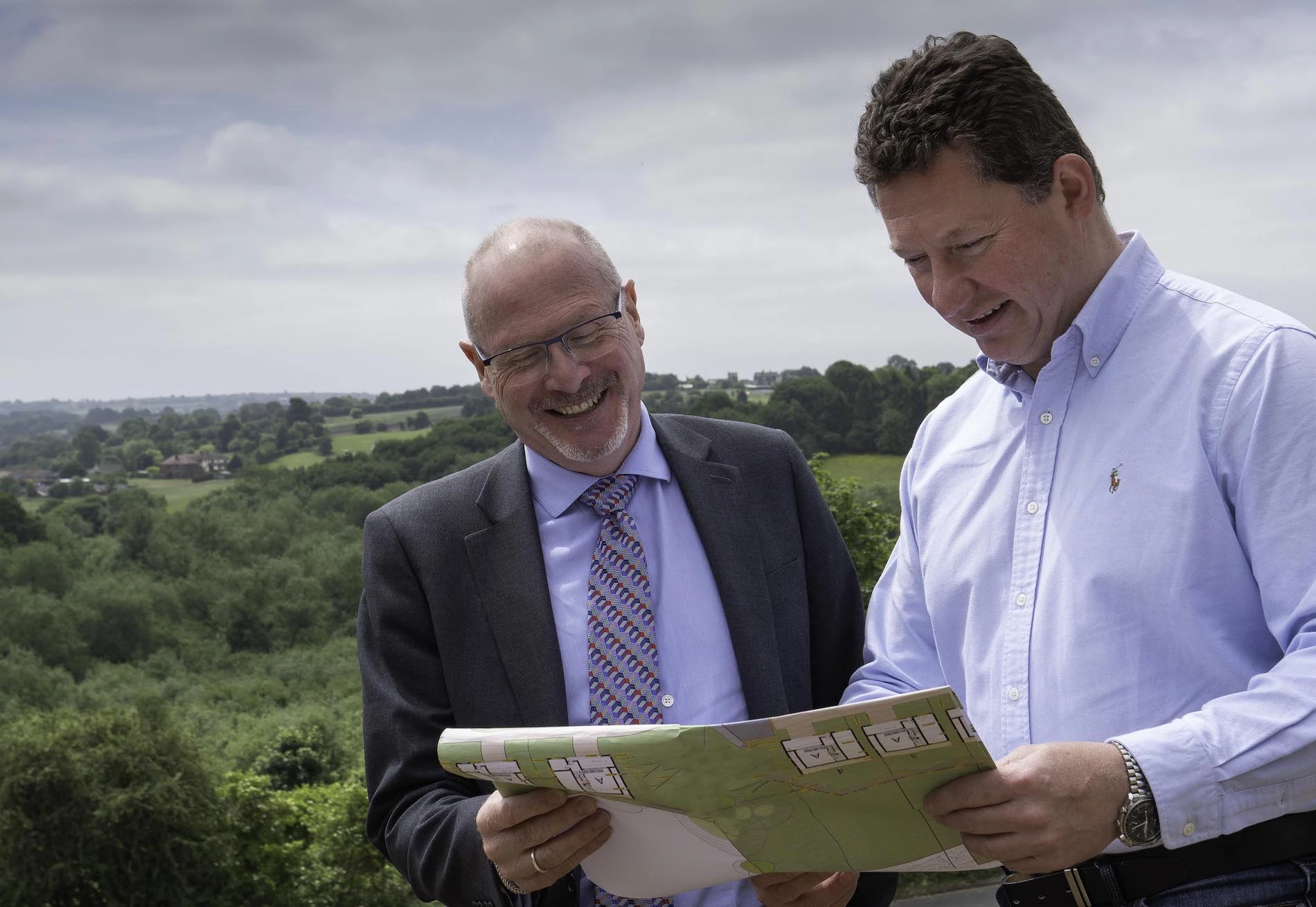 Neil Dickens, LSL Land & New Homes (left) and Tim Reeve, Advent Developments (right), with Post Hill in the background.