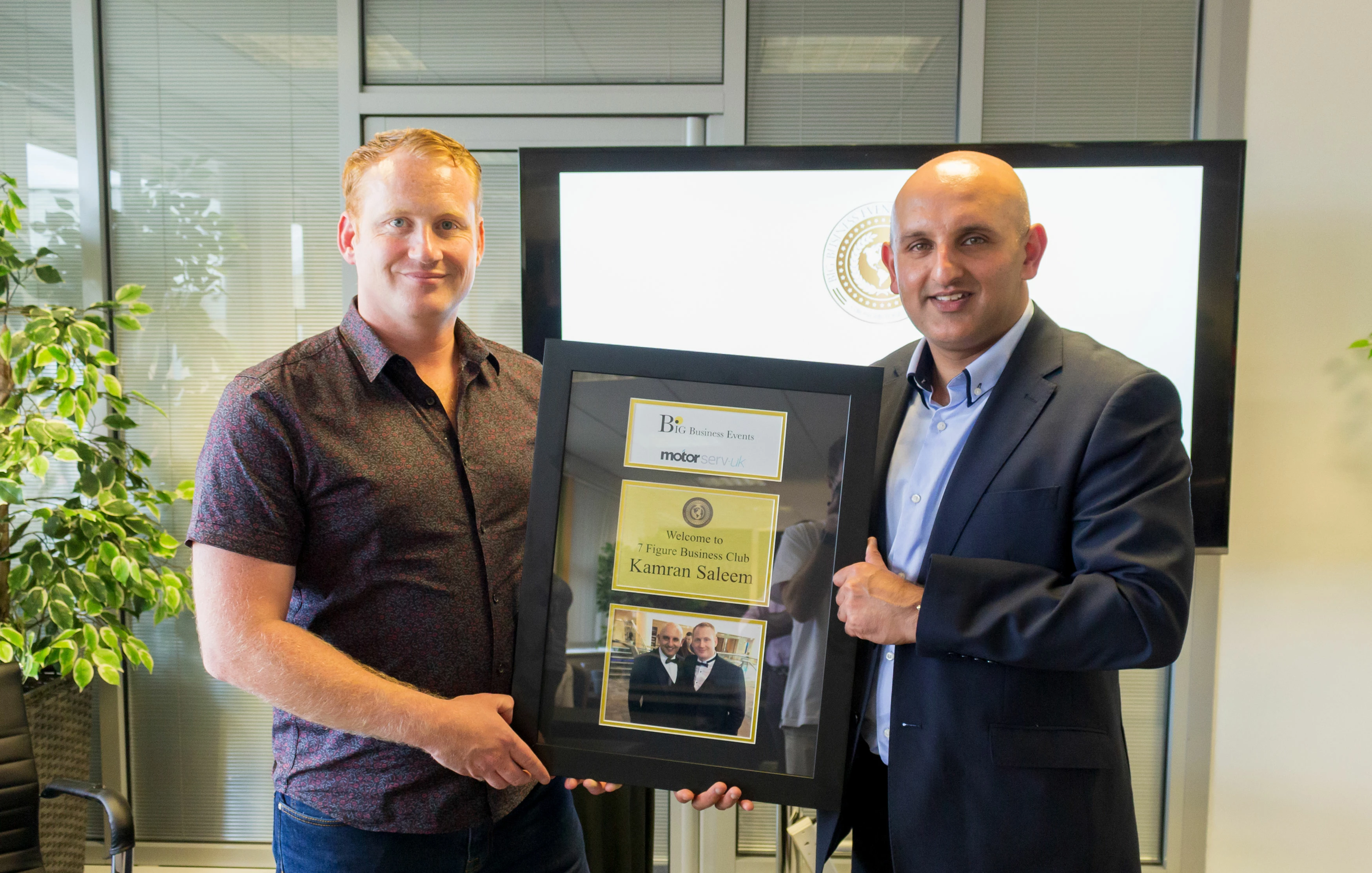 Owner of MotorServ UK, Kamran Saleem, is pictured receiving his ‘7 Figure Business Club’ certificate from Big Business Events Founder and Forbes Coach, Adam Stott.