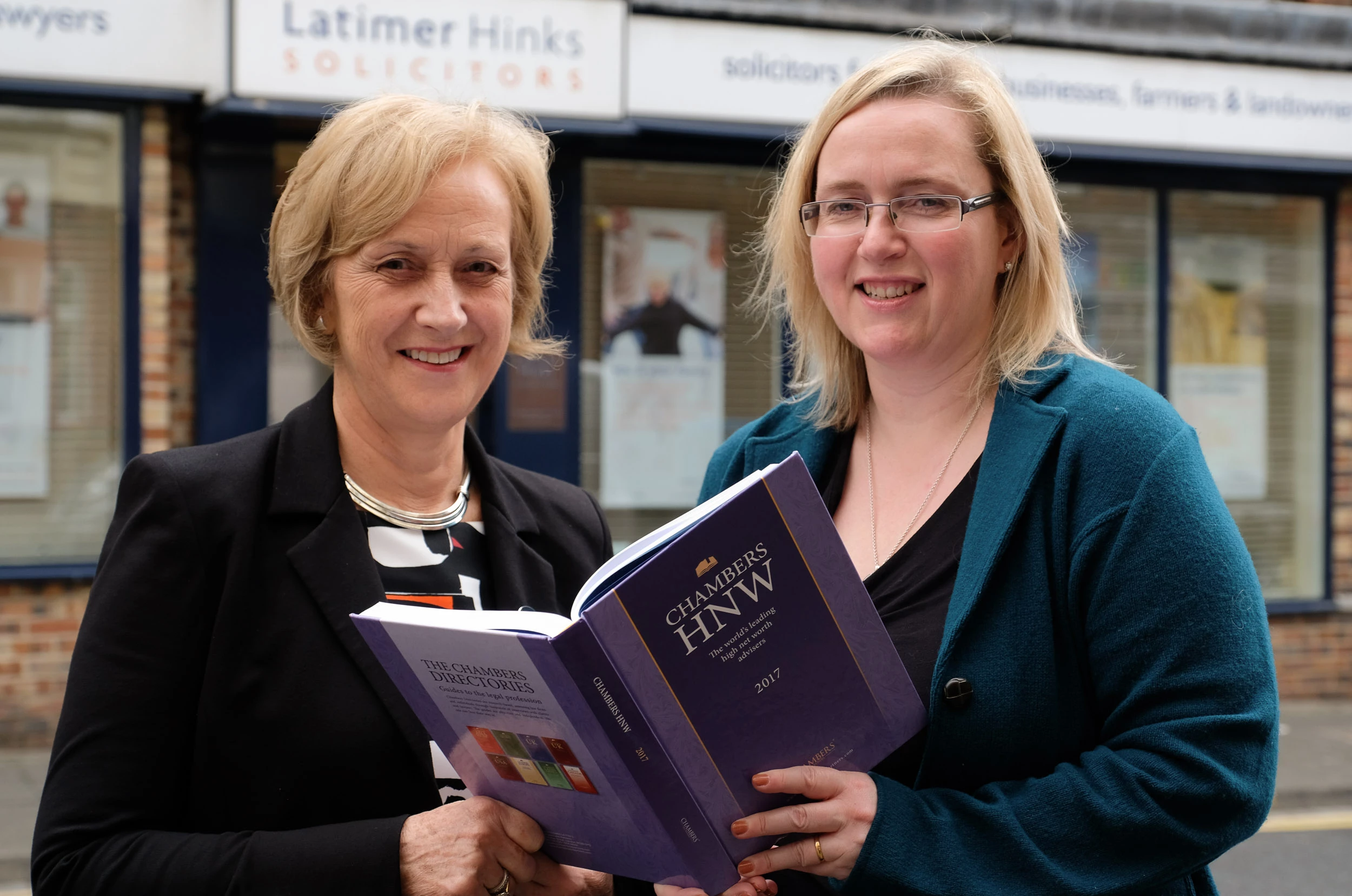 (L to R) Anne Elliott and Elizabeth Armstrong holding the HNW Guide