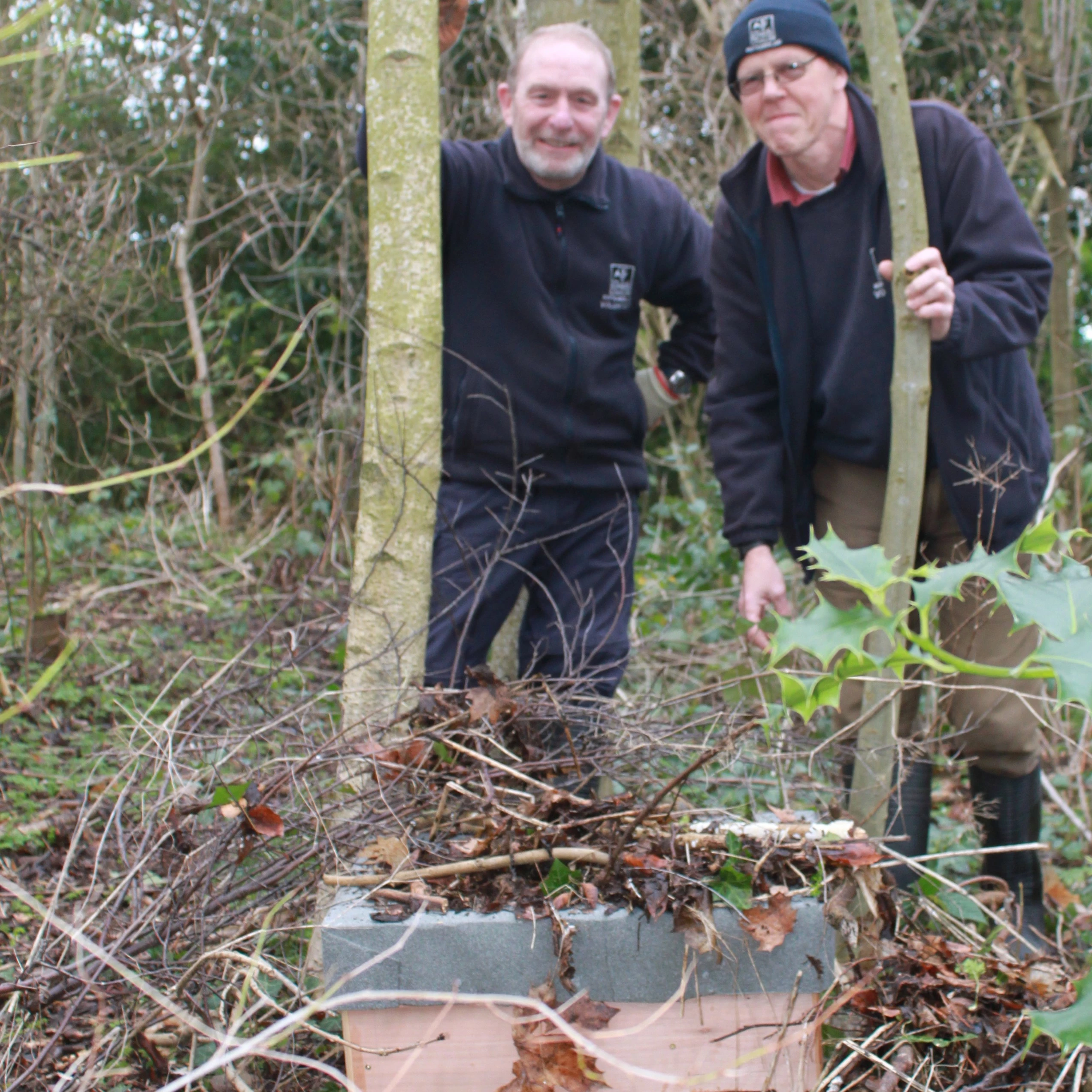 Northumberland Wildlife Trust Gardening Volunteers Derek Statton (left) and Joe Christie (right) with one of the hedgehog boxes made by the Newcastle Bridges School pupil.