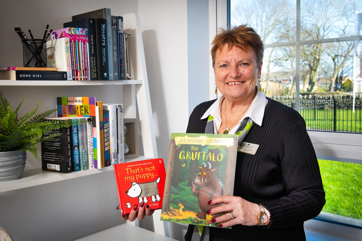 Sales Adviser, Shirley Drinkwater with the little library