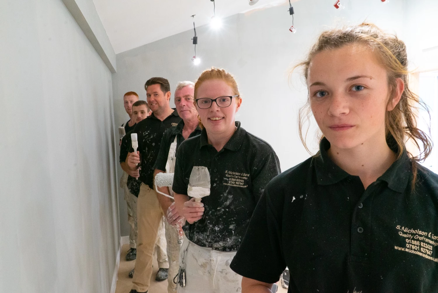 Stephen Nicholson (third from rear) with members of his team, including apprentices