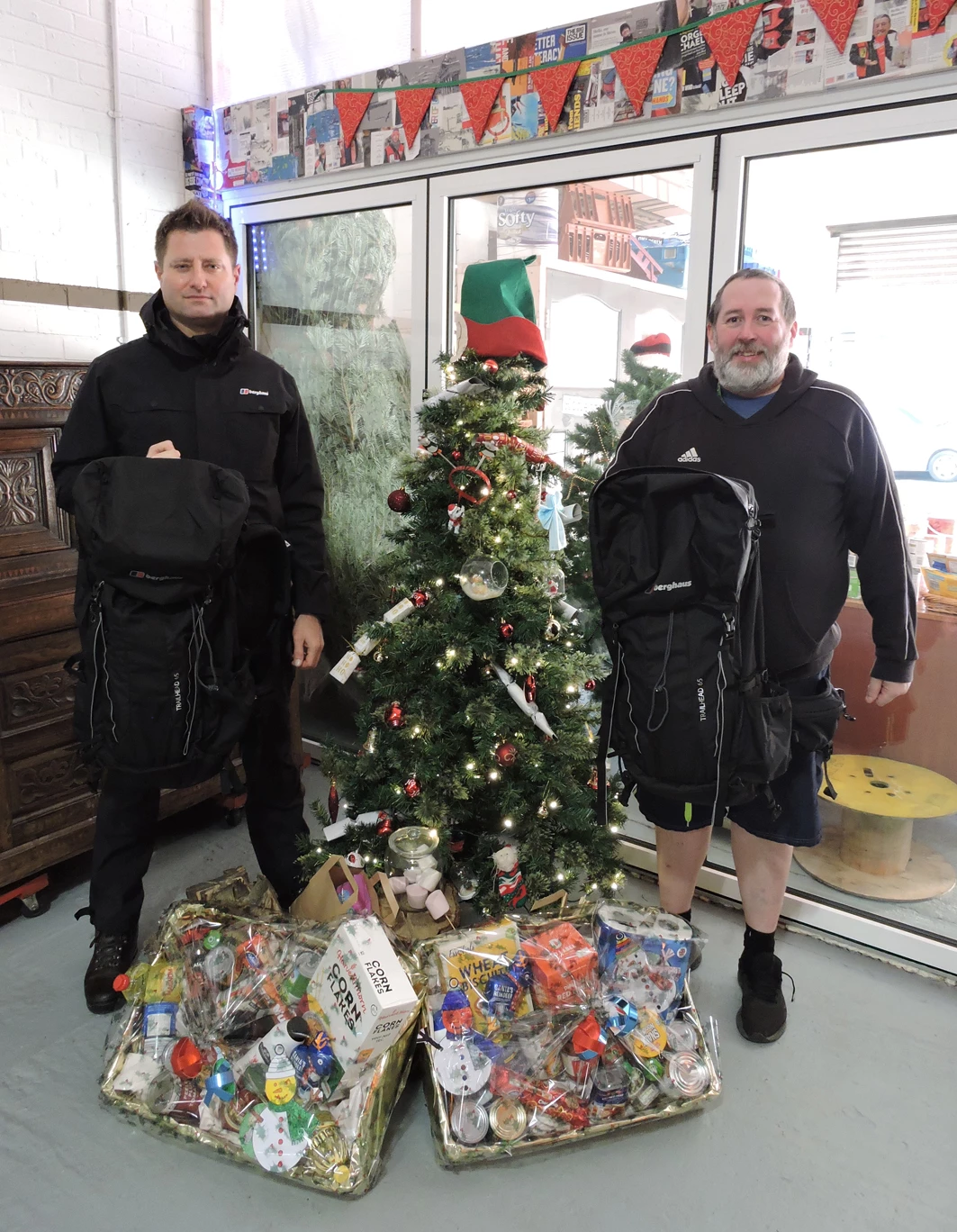 George Clarke (left) and Brian Burridge of North East Homeless with Berghaus rucksacks that will be used by charity volunteers over Christmas