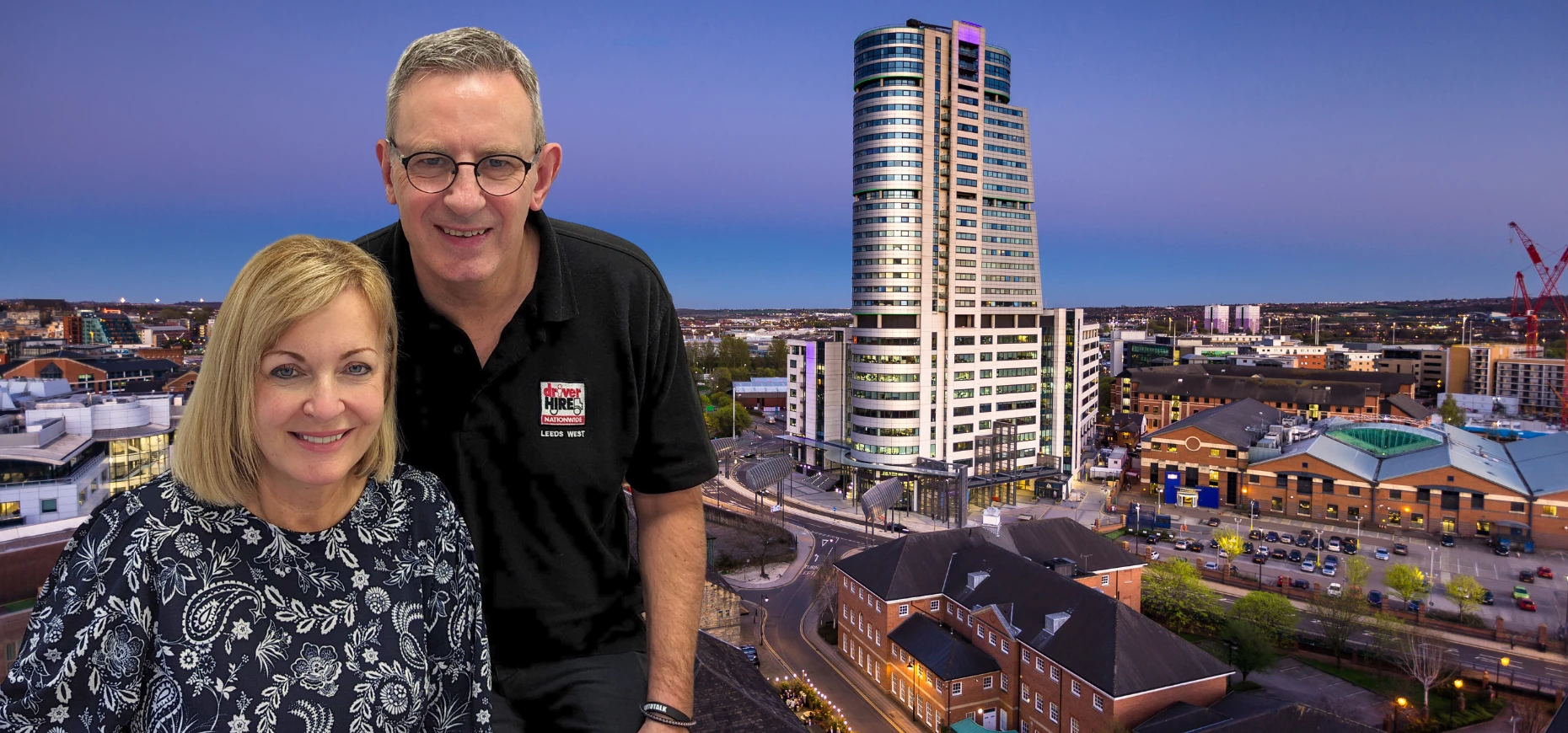 Tim and Fiona Hennah, franchise owners of driver employment agency, Driver Hire, pictured against the Leeds skyline.