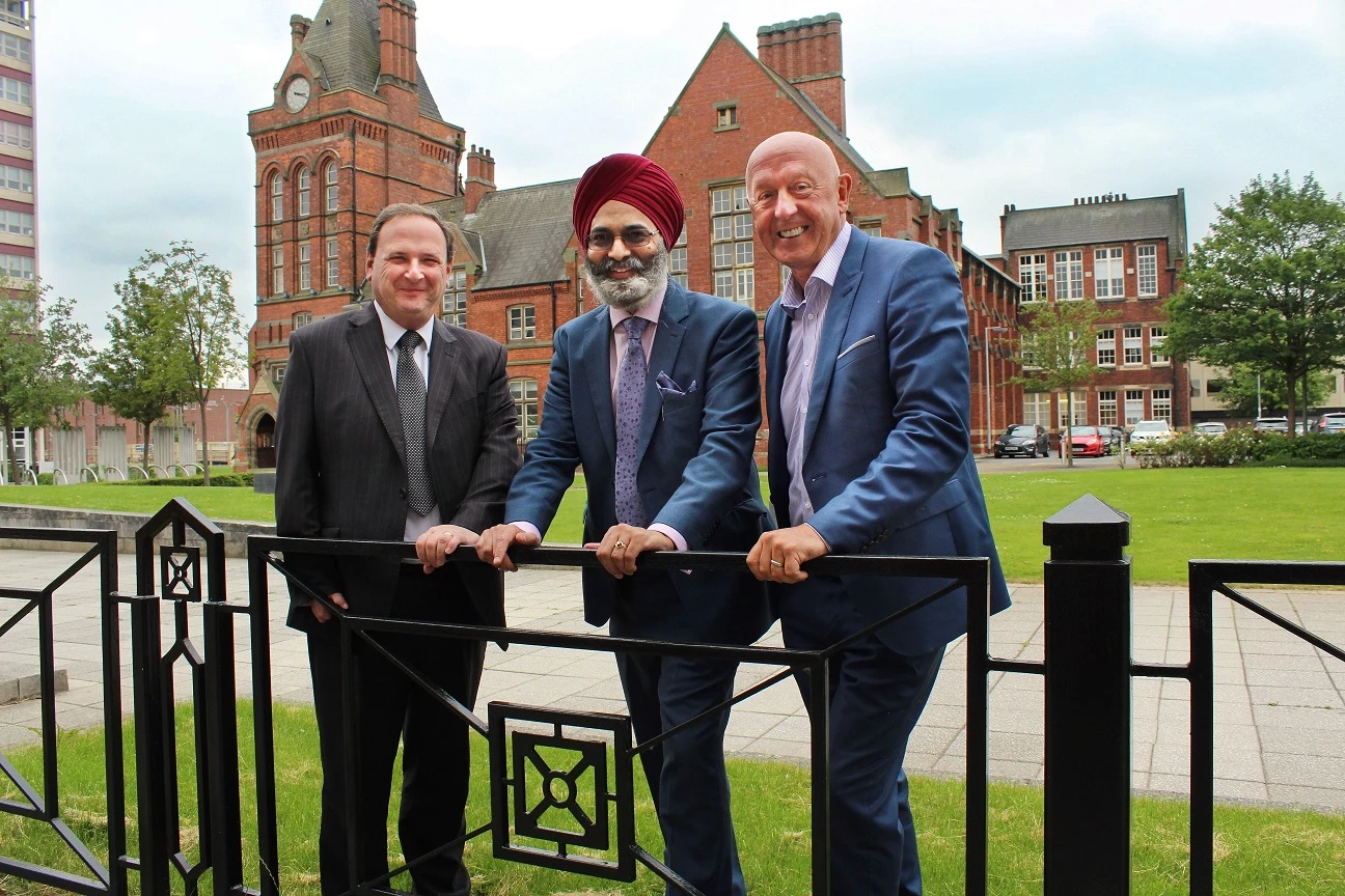 From left, Tony Blueitt and Gursharan Singh, of Chuhan & Singh, with Gary Lumby