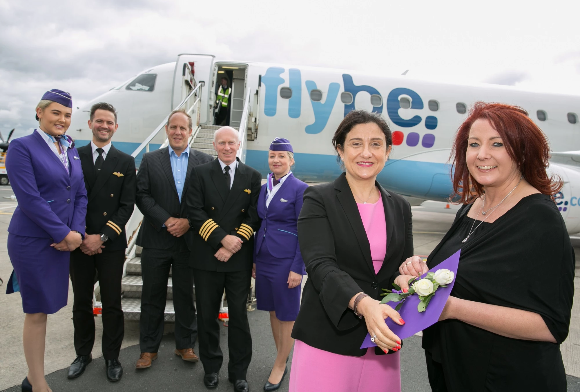 Flybe crew pose with the lucky winner alongside Flybe Director of Flight Operations Chris Coney-Jones and Flybe CEO Christine Ourmieres-Widener