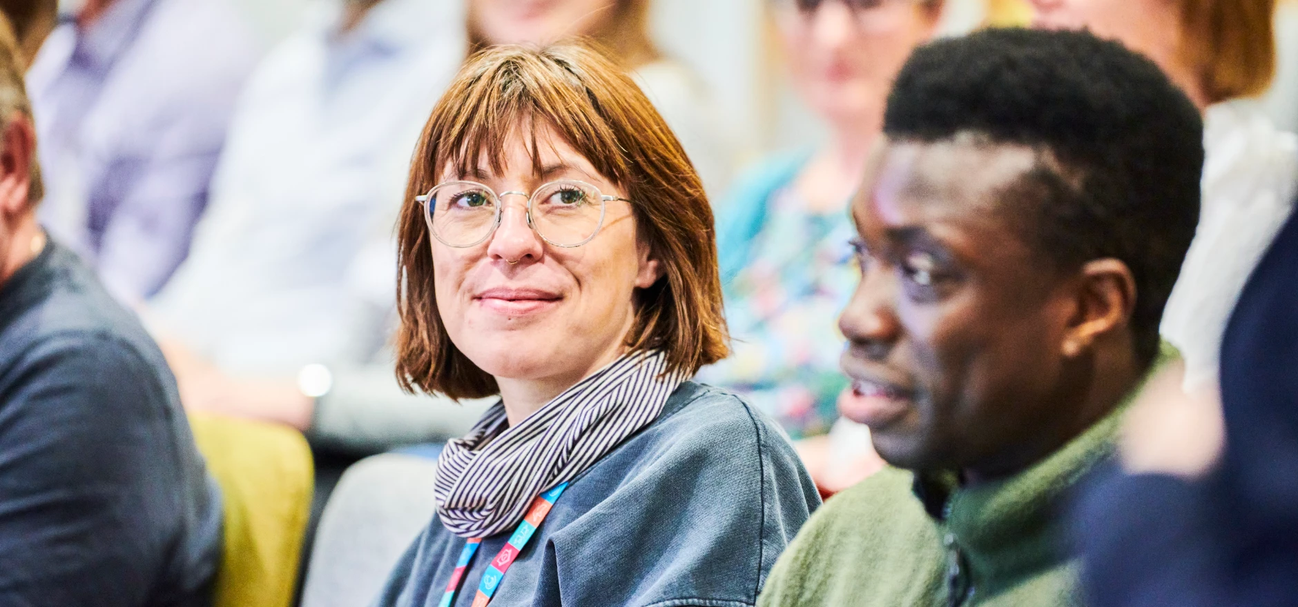 Two learners in a lecture theatre