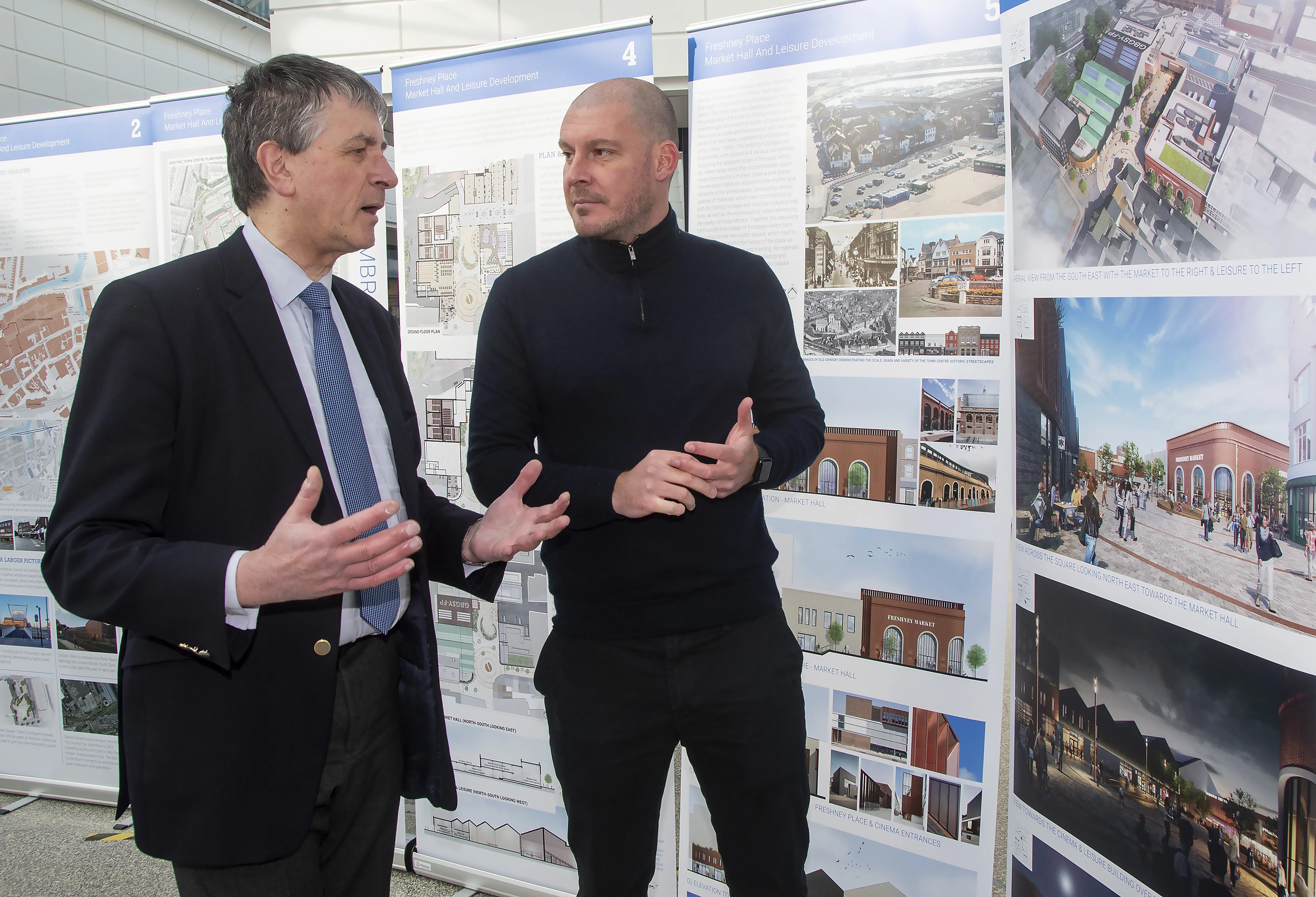 Looking at the new plans for the western end of Freshney Place and visiting the centre is North East Lincolnshire Council Leader Cllr Philip Jackson with Ben Hall representing the main contractor for the scheme Morgan Sindall.