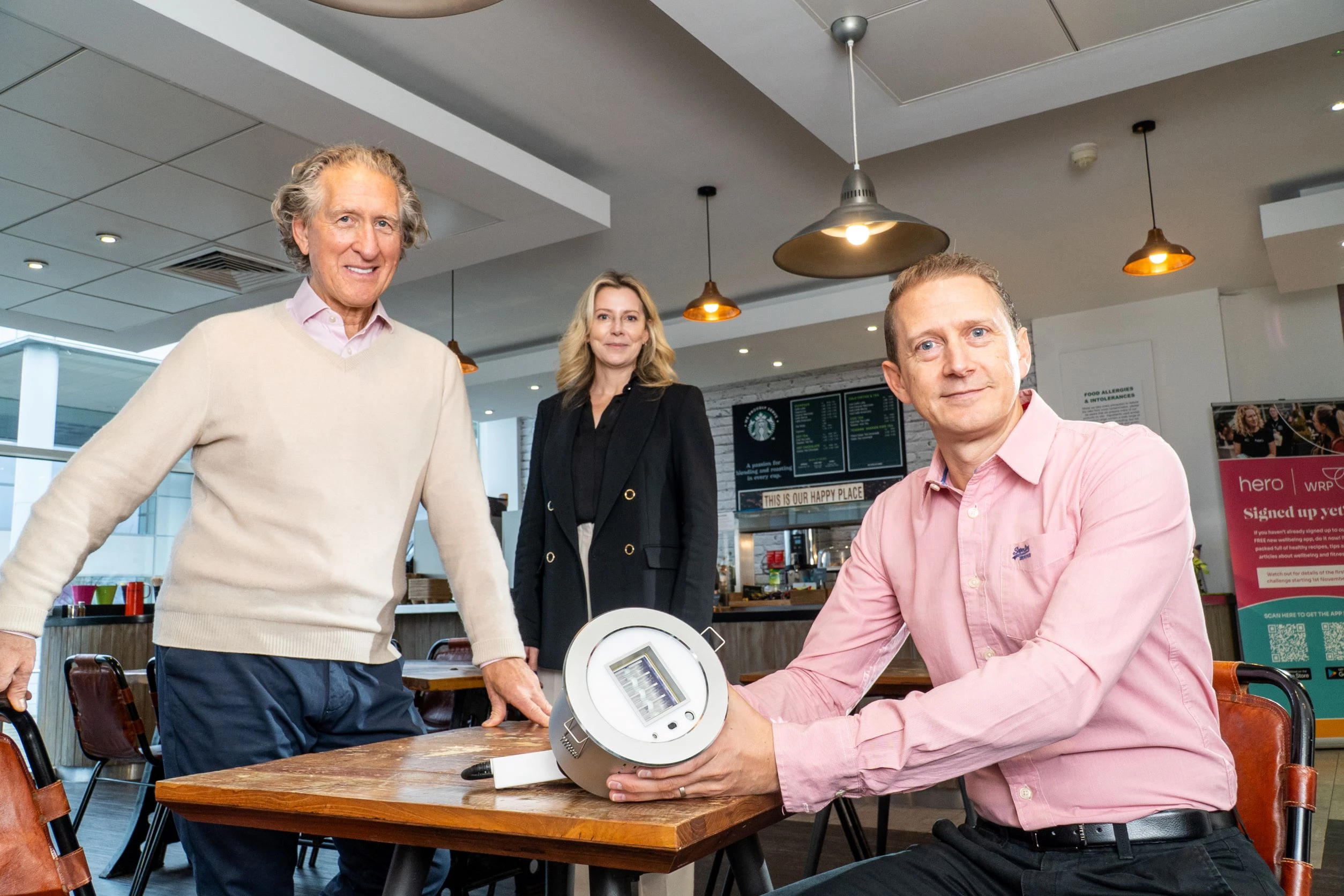 David Aspin of Munroe K(left); Samantha Moore of Moore Medtech; and Jamie Moore with a Far-UVC light fixture