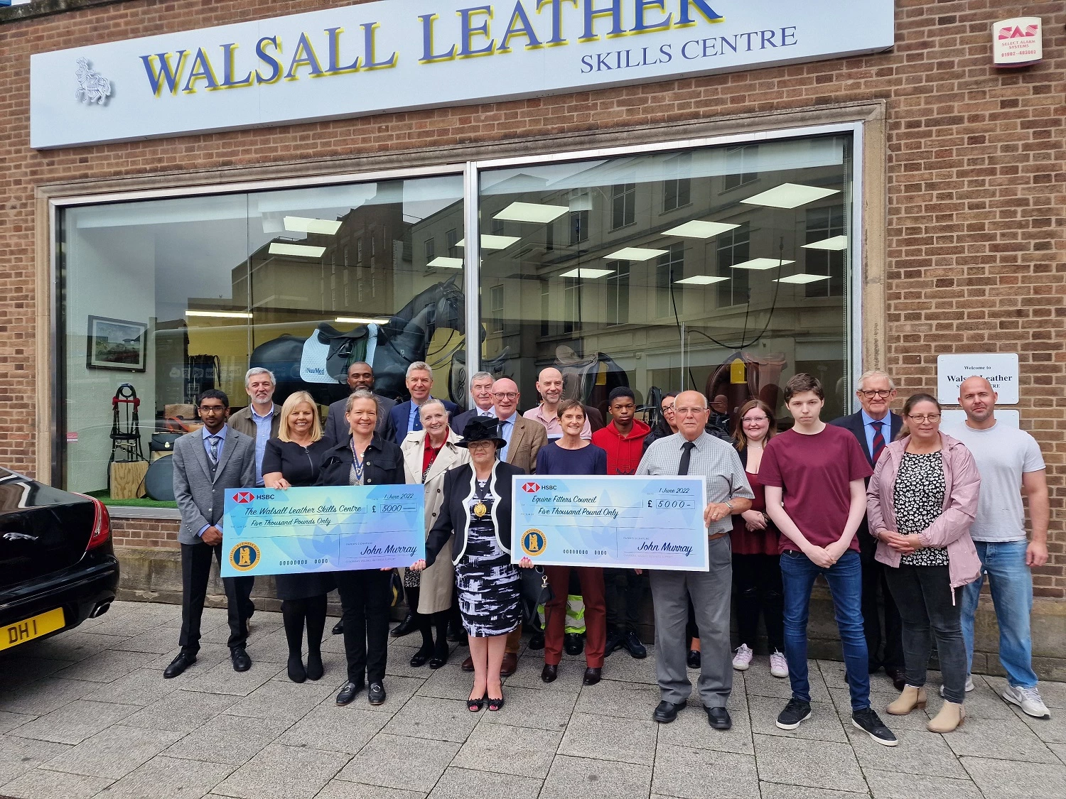 Rose Martin, Mayor of Walsall, centre, presents the Walsall Business Support grants