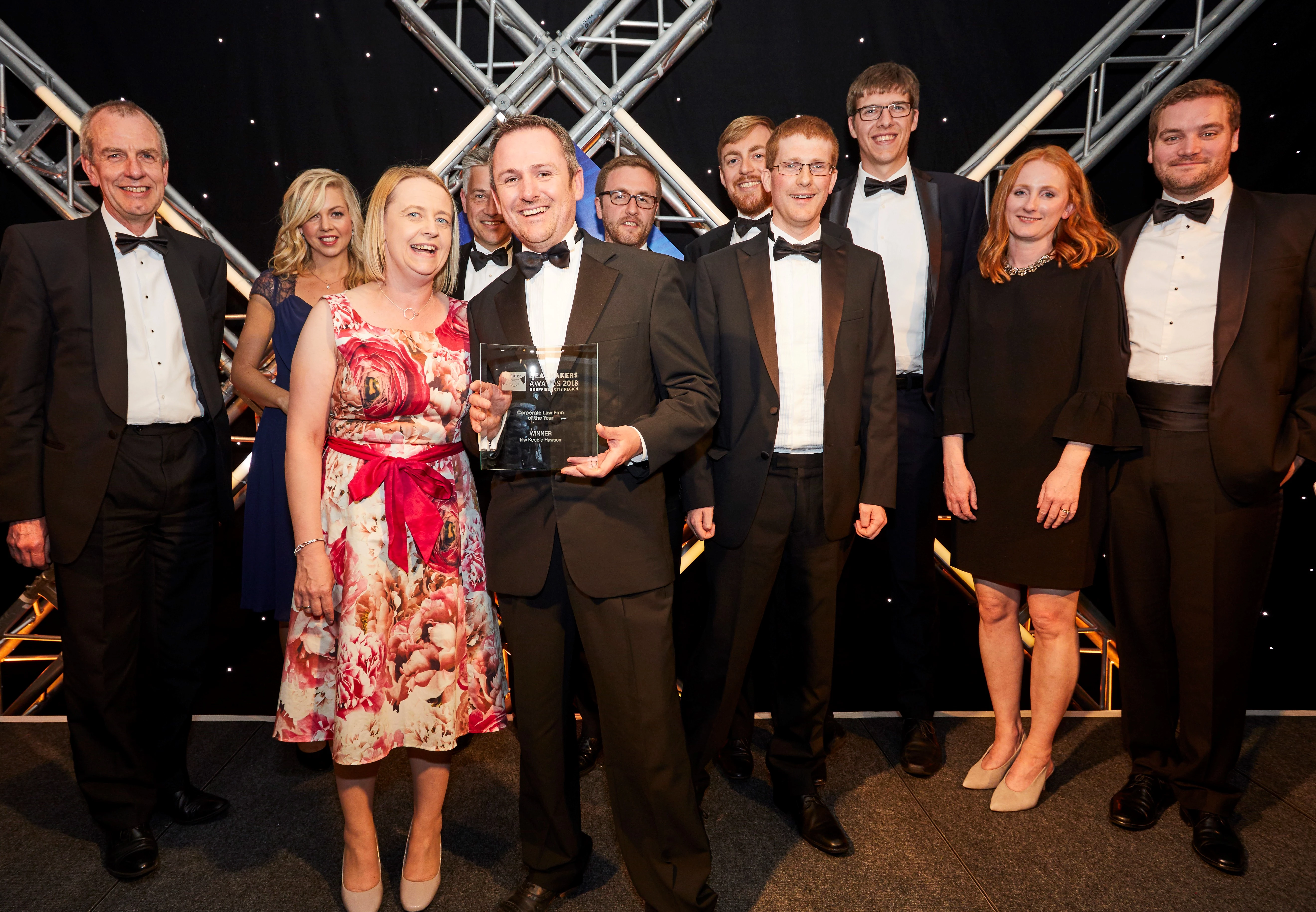 Keebles partner Matt Ainsworth receives the Law Firm of the Year award from Lisa Leighton, BHP partner and sponsor. 