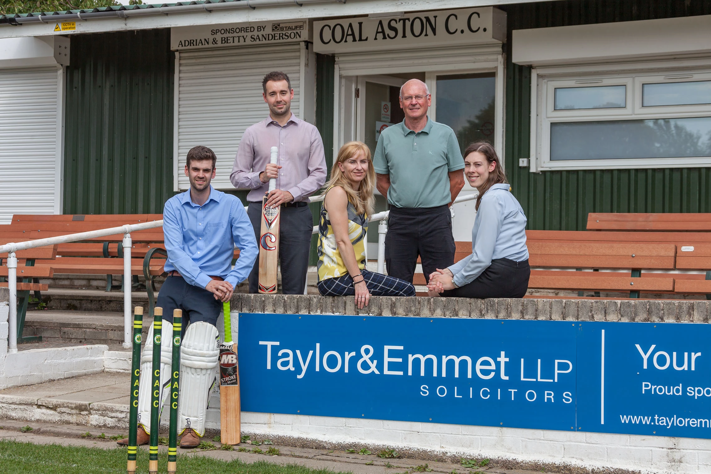 Taylor&Emmet's Nichola Barnes (centre) and team at Coal Aston Cricket Club with treasurer, John Lawrence (second from right). 