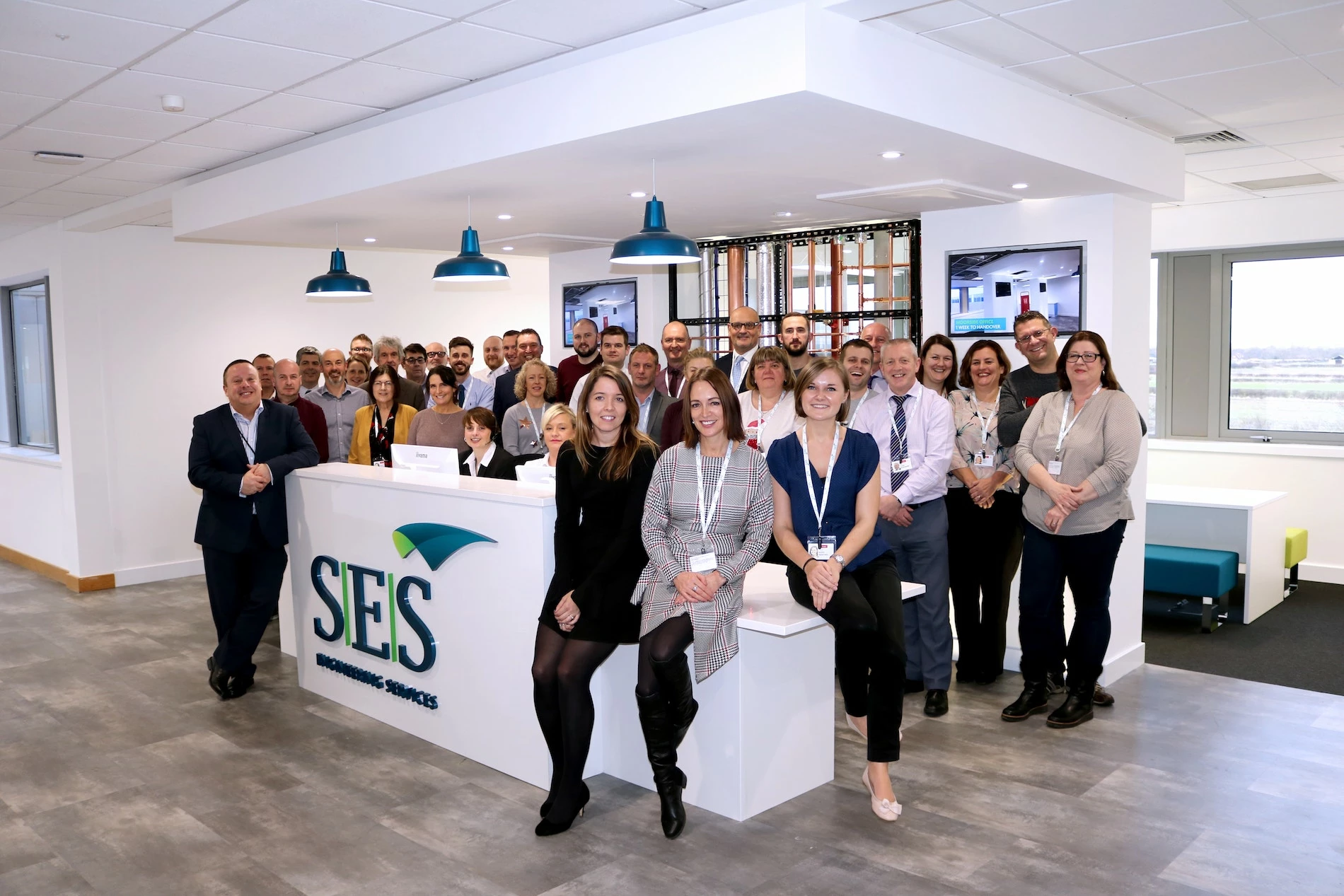 SES York relocates to a new home – Steve Joyce (to the left of the reception desk) with some of the team in the York office.