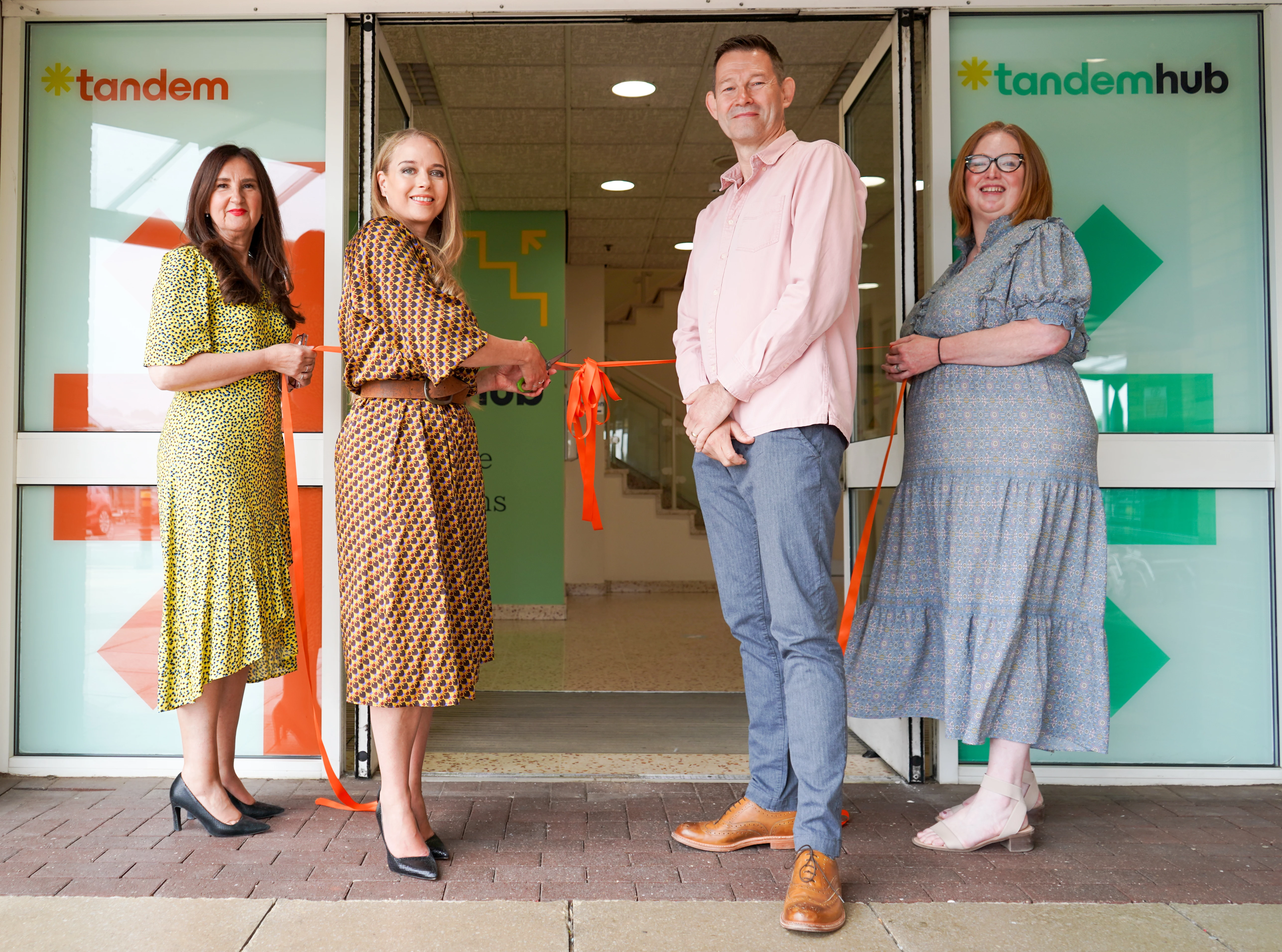 L-R Alison Clayton, conference centre manager, Sarah Bentley, chief executive, Bruce Warnes, chair of trustees, and Becky Wilson, deputy chief executive cut the ribbon at the Tandem launch event.